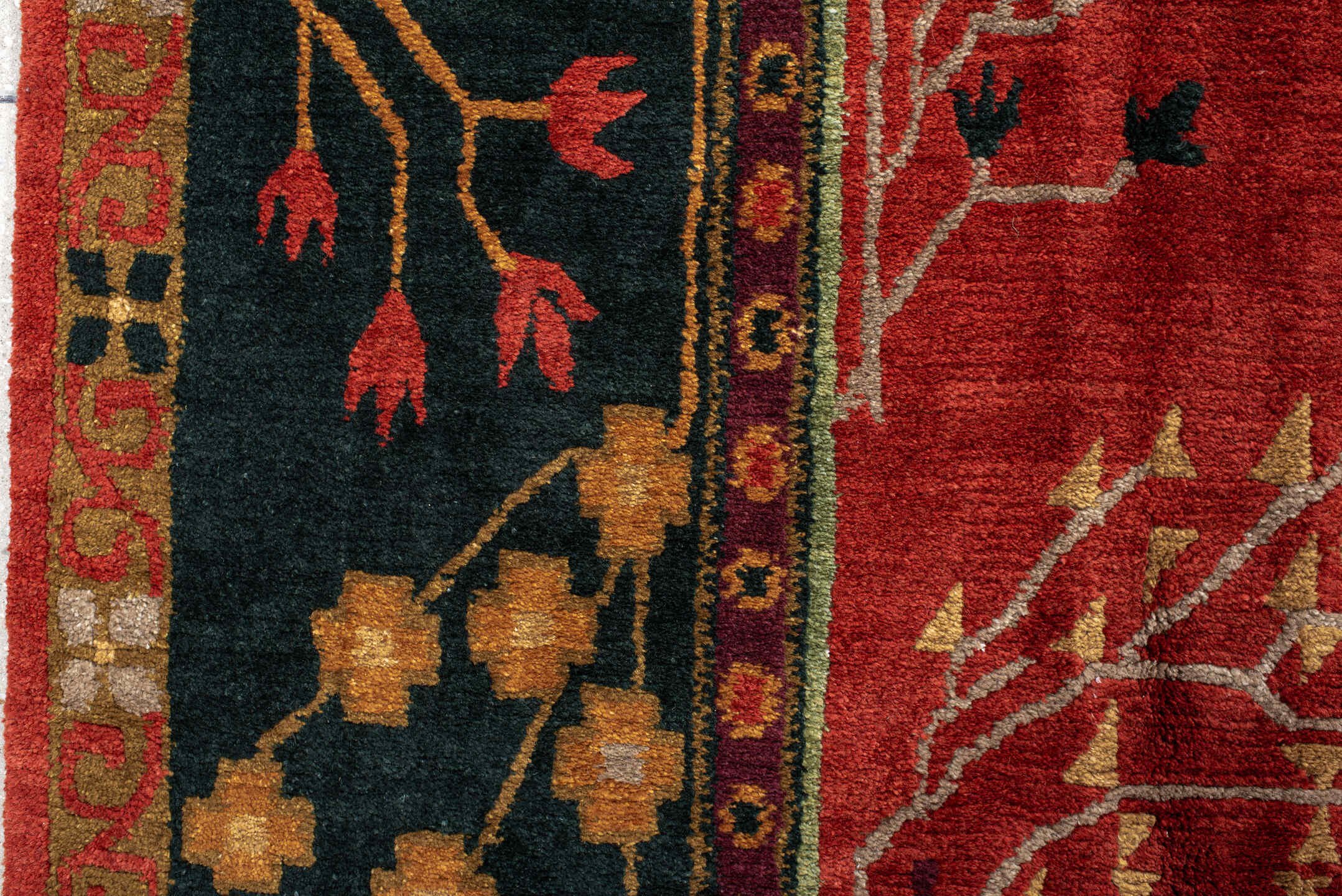 9' x 13' one-of-a-kind handmade vintage Donegal large size rug. Color palette: rust, navy, ivory, sage, peach, burgundy
