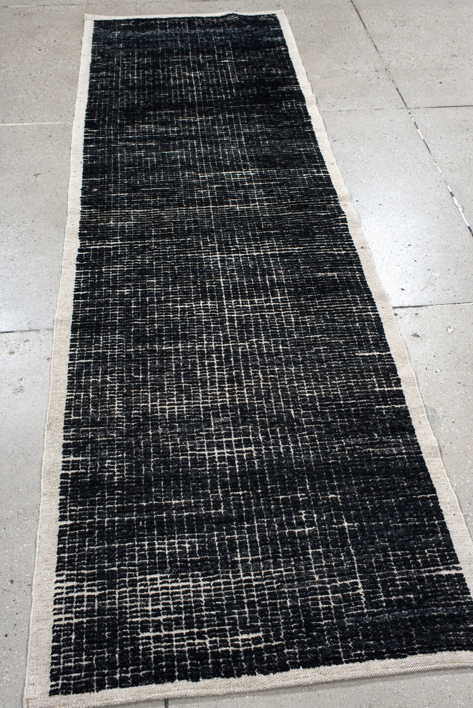 2' x 8' one-of-a-kind handmade vintage Tulu runner rug. Color palette: charcoal, ivory, gray, black