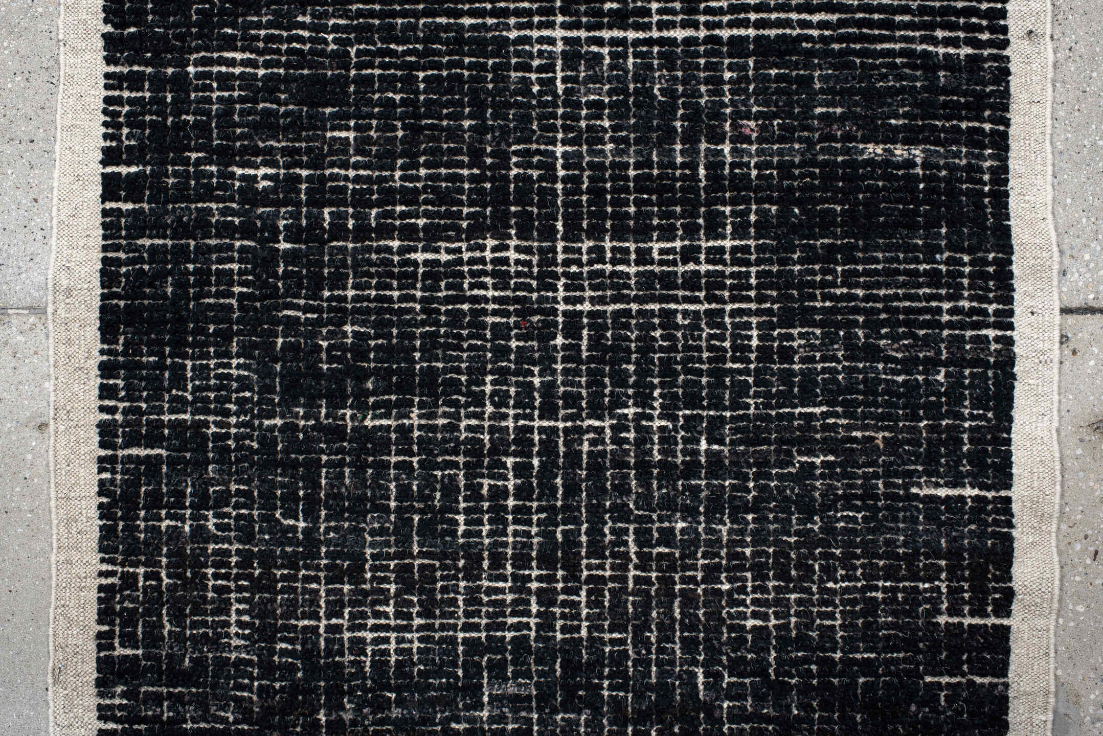 2' x 8' one-of-a-kind handmade vintage Tulu runner rug. Color palette: charcoal, ivory, gray, black
