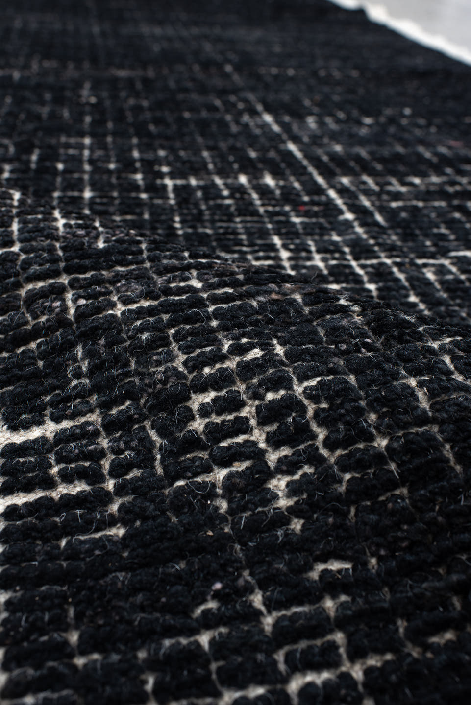 2' x 8' one-of-a-kind handmade vintage Tulu runner rug. Color palette: charcoal, ivory, gray, black