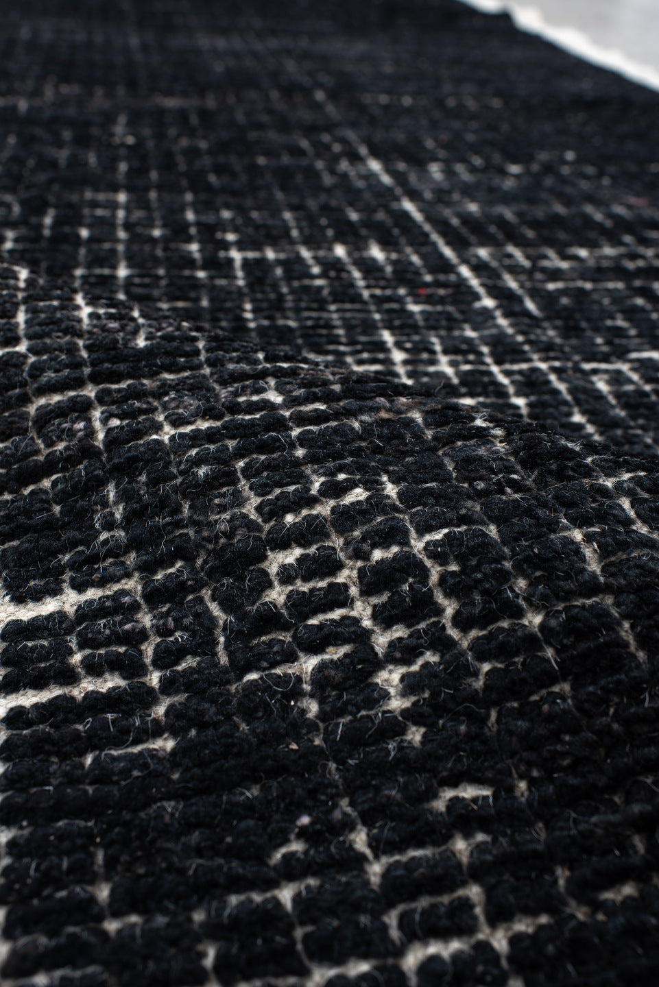 2' x 8' one-of-a-kind handmade vintage Tulu runner rug. Color palette: charcoal, ivory, gray, black