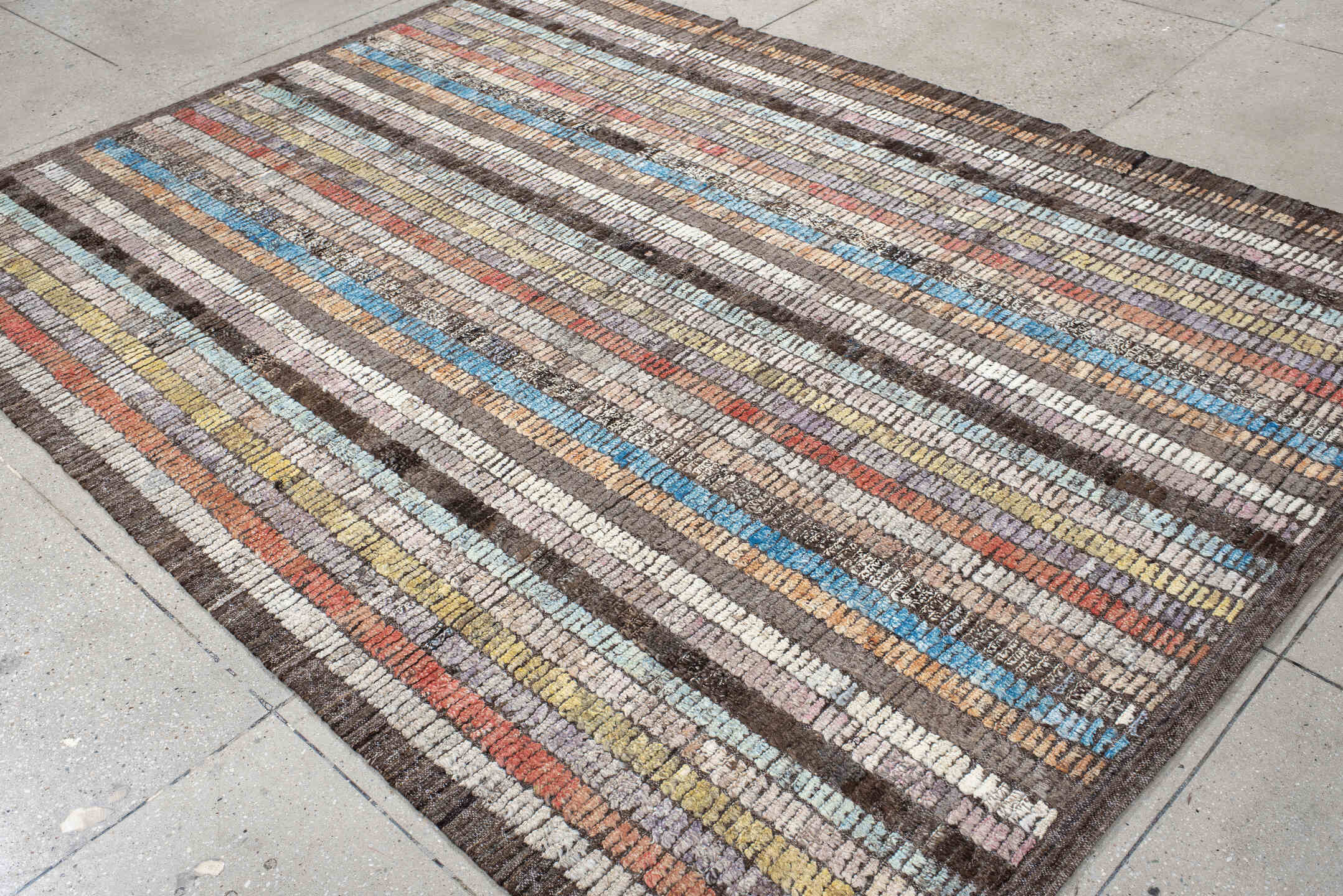 6' x 9' one-of-a-kind handmade vintage Tulu medium size rug. Color palette: brown, ivory, sky blue, coral, lavender, gold