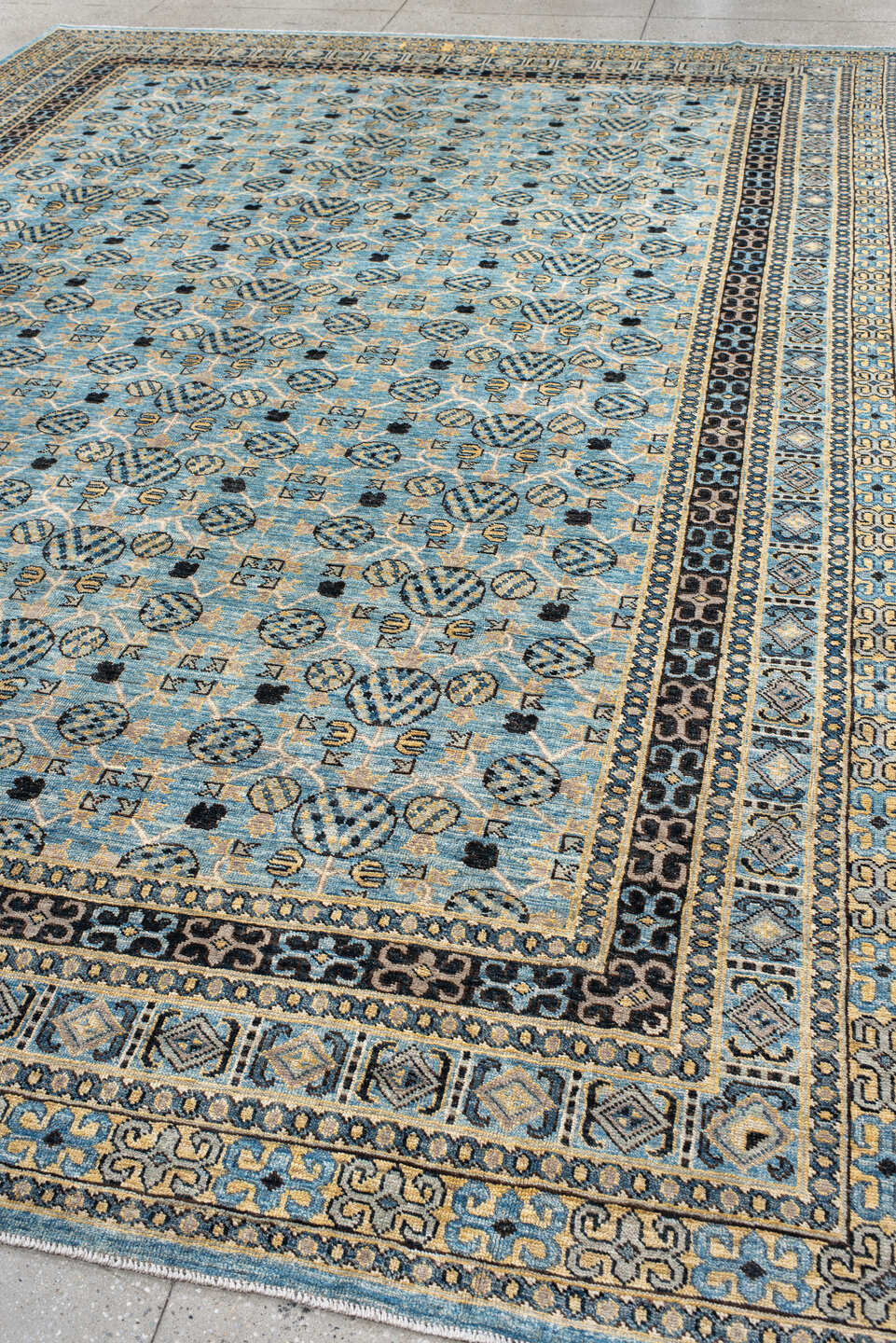 9' x 14' one-of-a-kind handmade vintage Khotan large size rug. Color palette: black, blue, brown, burlywood, charcoal