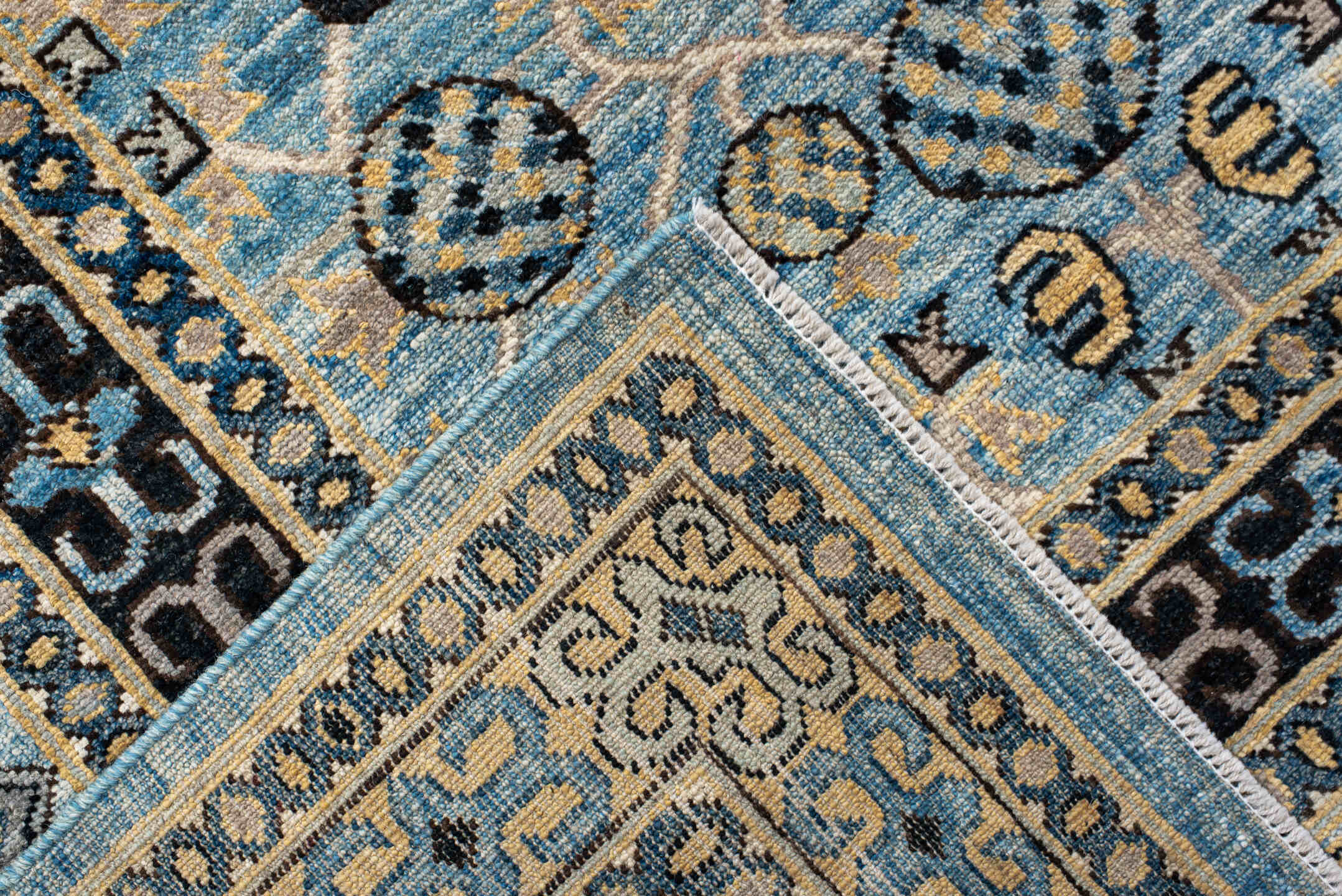 9' x 14' one-of-a-kind handmade vintage Khotan large size rug. Color palette: black, blue, brown, burlywood, charcoal