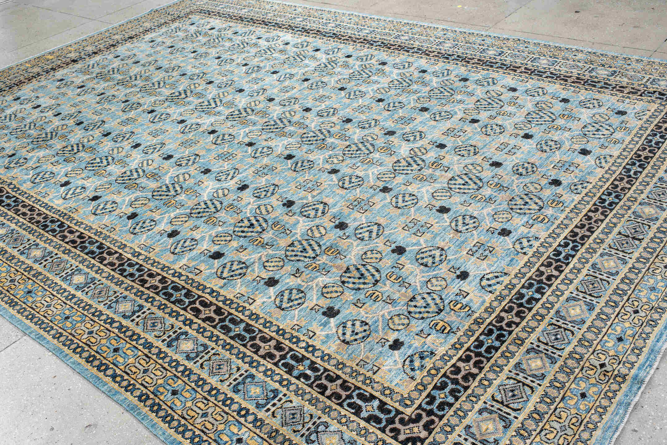 9' x 14' one-of-a-kind handmade vintage Khotan large size rug. Color palette: black, blue, brown, burlywood, charcoal