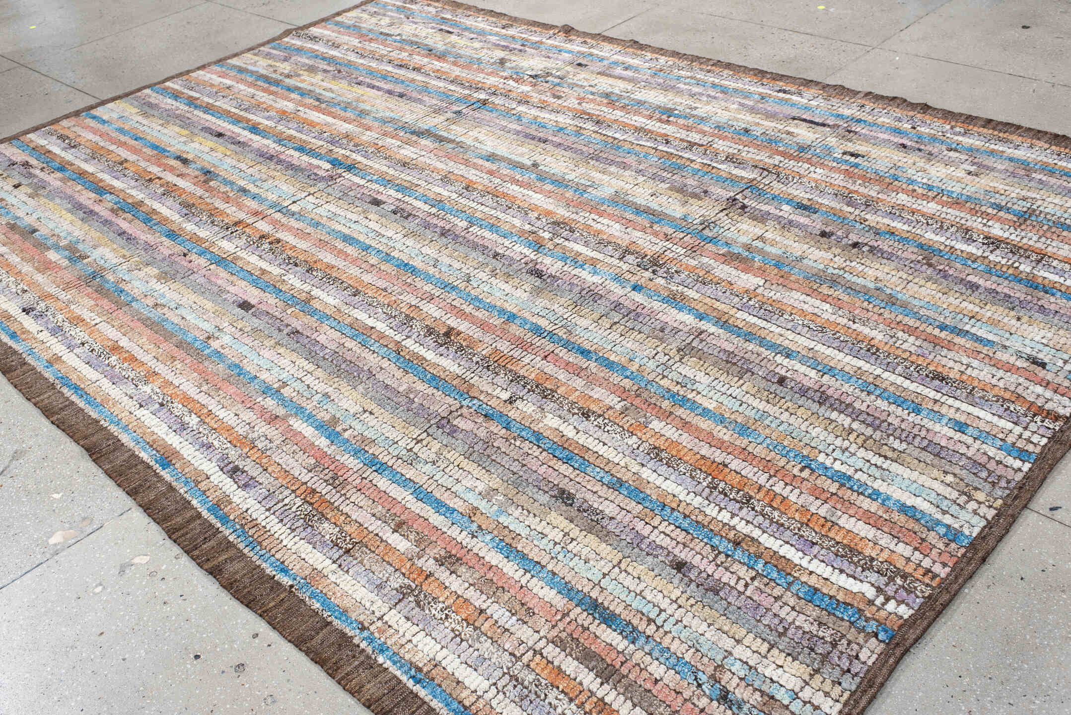 8' x 11' one-of-a-kind handmade vintage Tulu large size rug. Color palette: ivory, taupe, brown, lavender, turquoise, coral