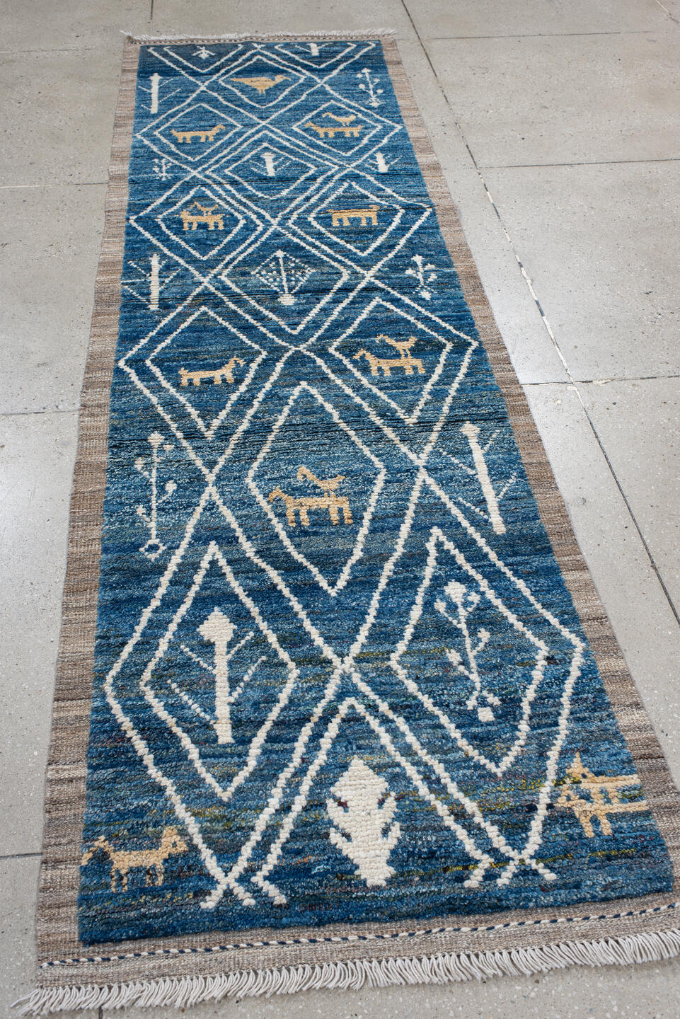 2' x 10' one-of-a-kind handmade vintage Tulu runner rug. Color palette: arapawa, blue, brown, gainsboro, gray, light blue