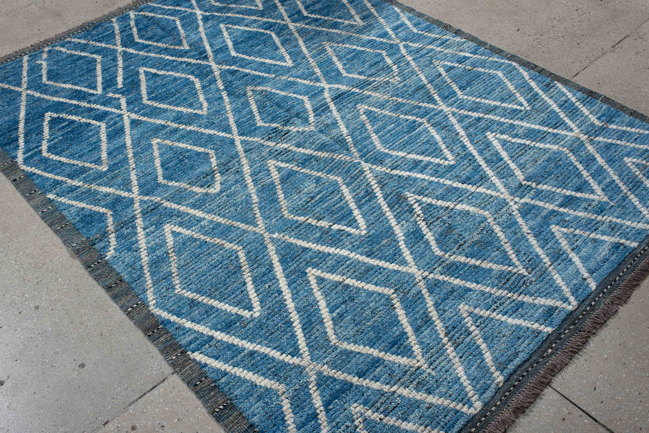 5' x 6' one-of-a-kind handmade vintage Tulu rug. Color palette: blue, ivory, slate, charcoal, gray, black