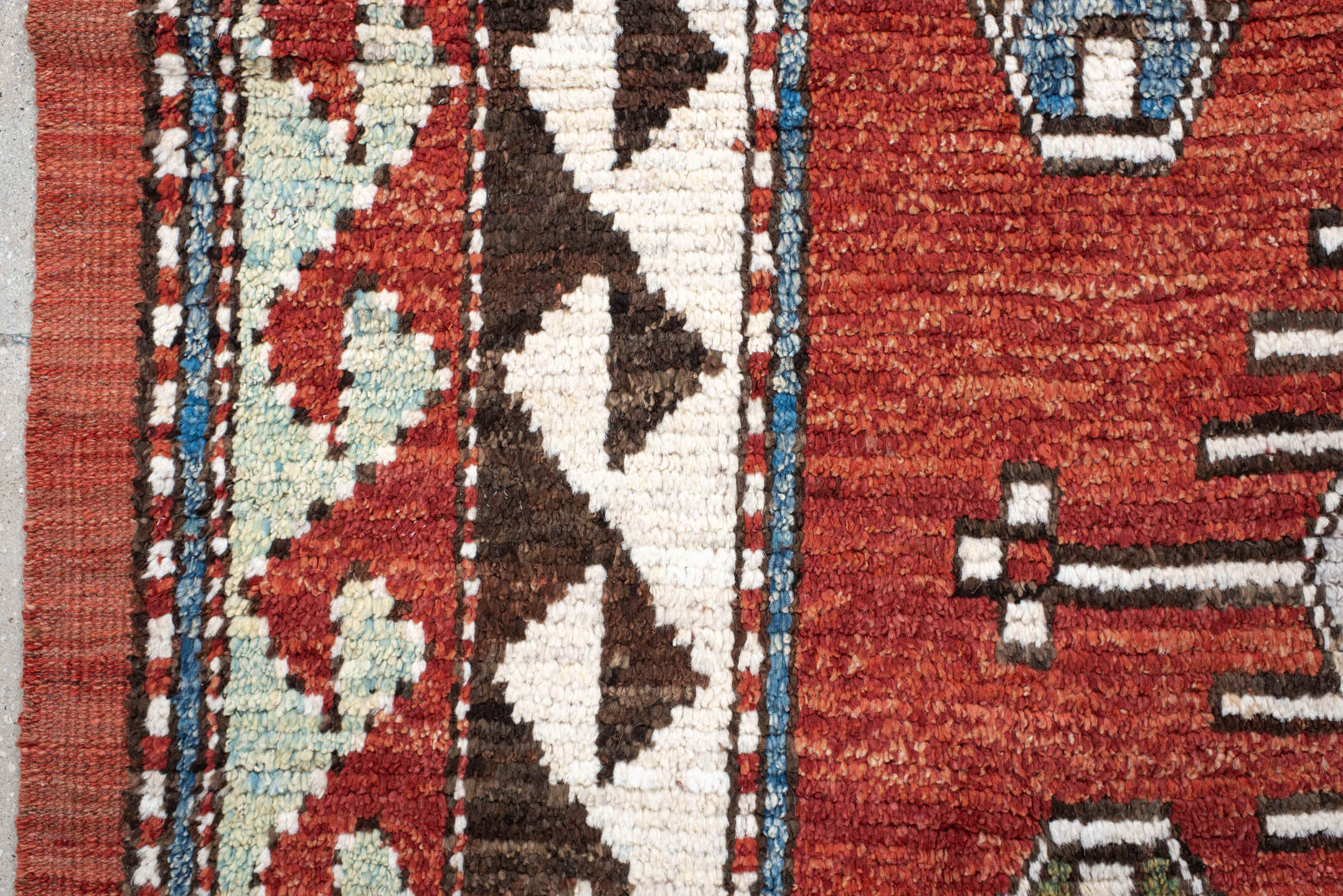 6' x 10' one-of-a-kind handmade vintage Tulu large size rug. Color palette: rust, ivory, brown, brick, blue, olive, charcoal