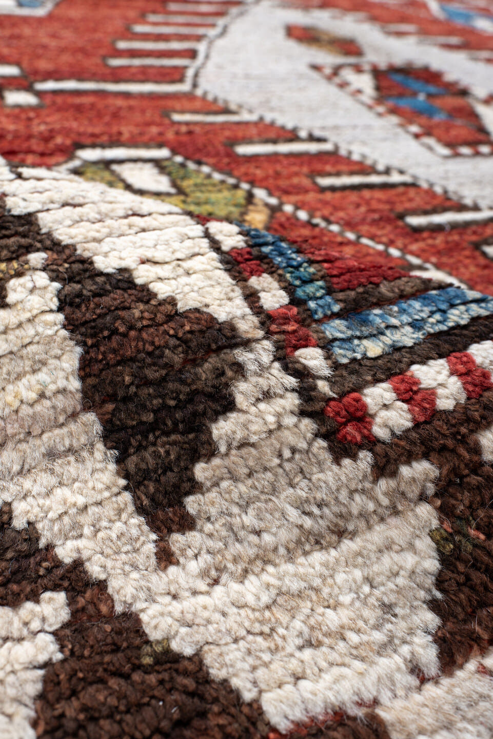 6' x 10' one-of-a-kind handmade vintage Tulu large size rug. Color palette: rust, ivory, brown, brick, blue, olive, charcoal
