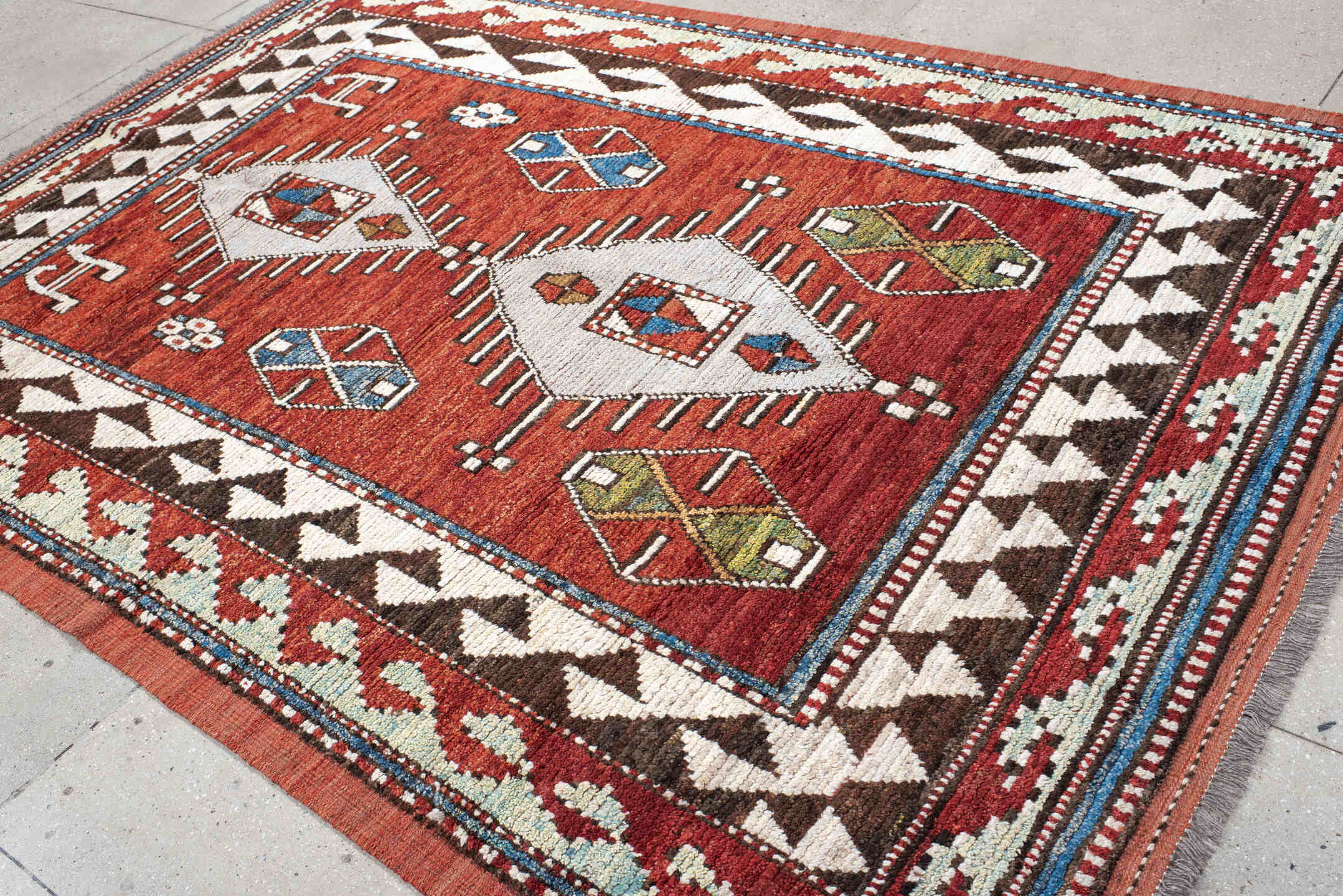 6' x 10' one-of-a-kind handmade vintage Tulu large size rug. Color palette: rust, ivory, brown, brick, blue, olive, charcoal