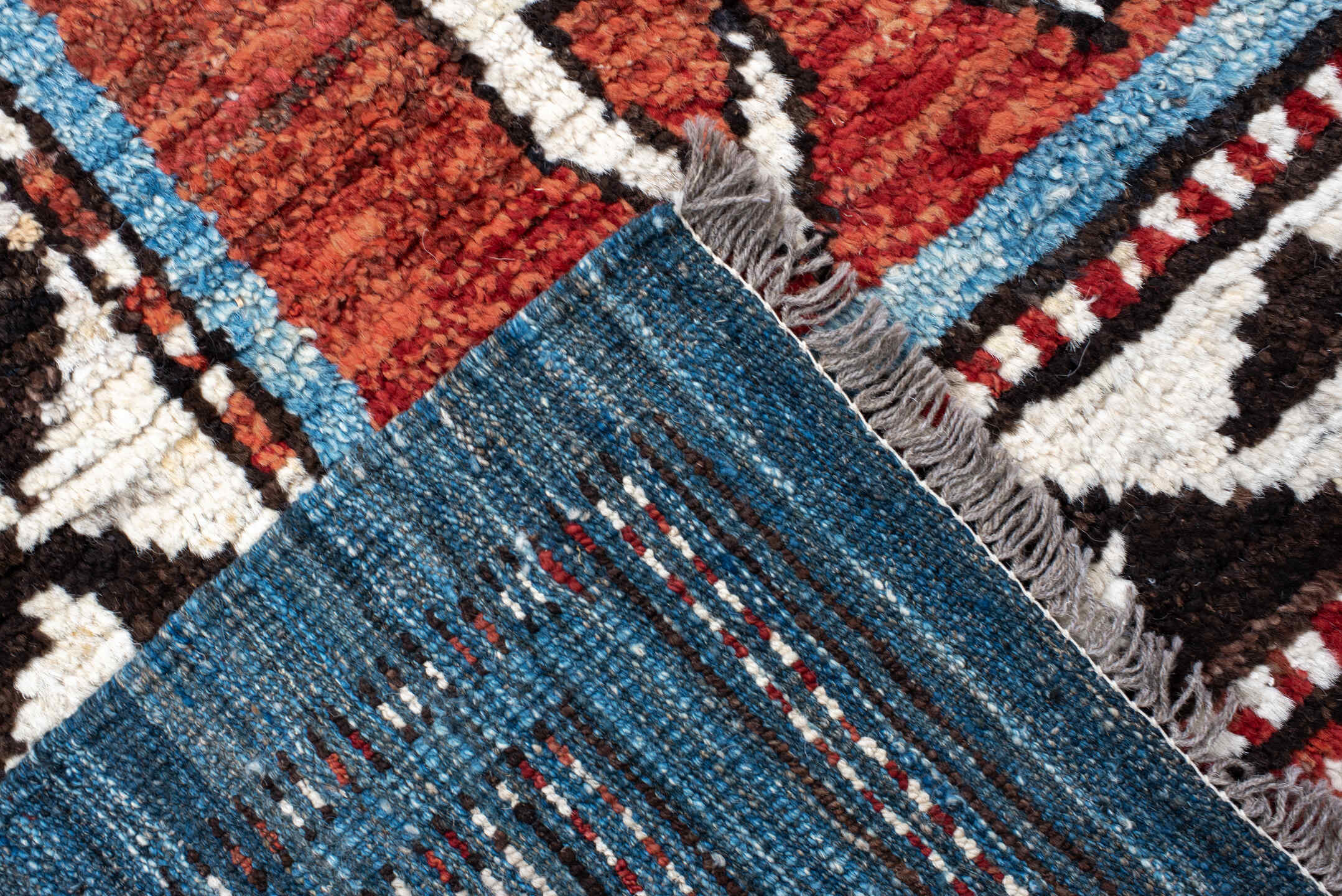 6' x 9' one-of-a-kind handmade vintage Tulu medium size rug. Color palette: rust, ivory, black, blue, brown, terracotta