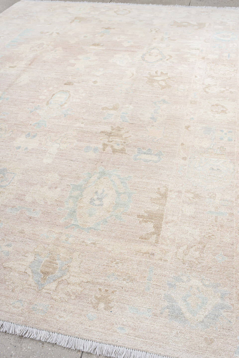 8' x 12' one-of-a-kind handmade vintage Oushak large size rug. Color palette: ivory, cream, blush, pale blue, beige, sand