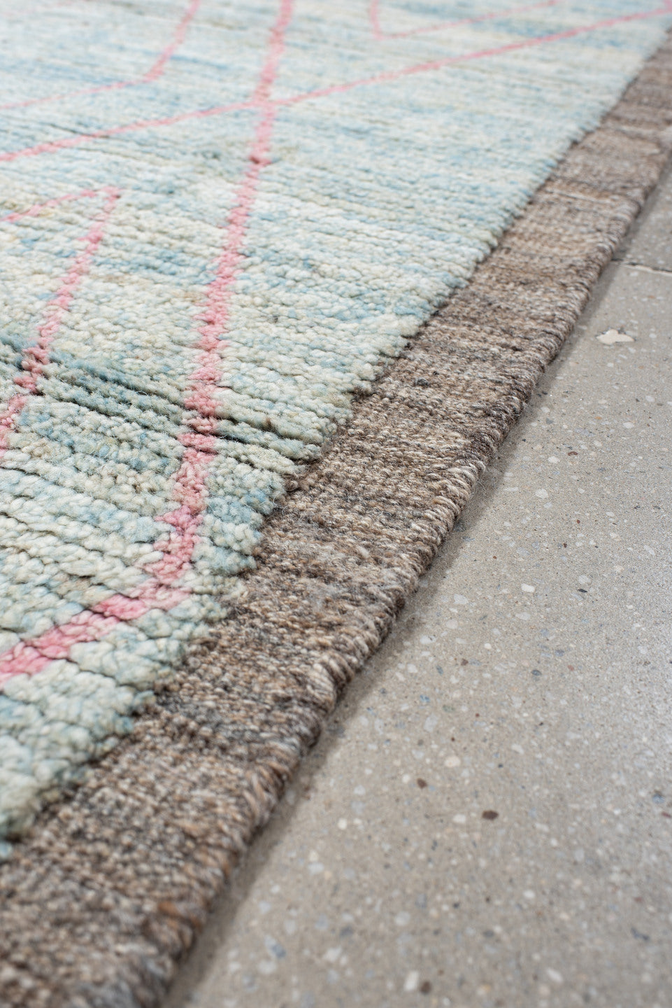 3' x 9' one-of-a-kind handmade vintage Tulu runner rug. Color palette: gray, pink, light gray, off-white, light blue