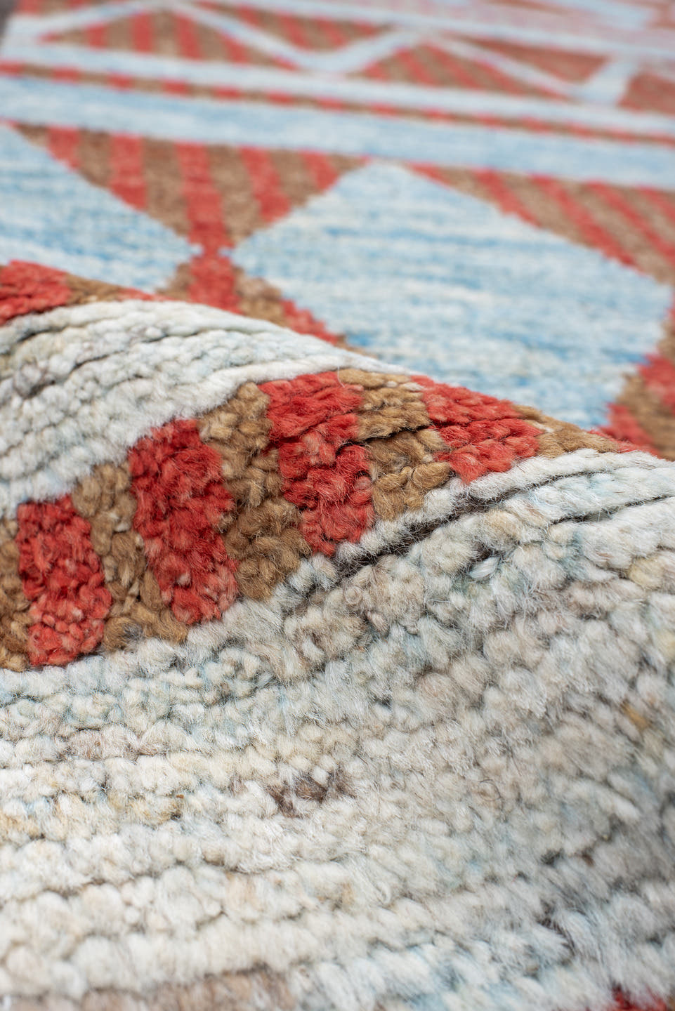 3' x 16' one-of-a-kind handmade vintage Tulu runner rug. Color palette: rust, ivory, sky blue, charcoal, terracotta, brown