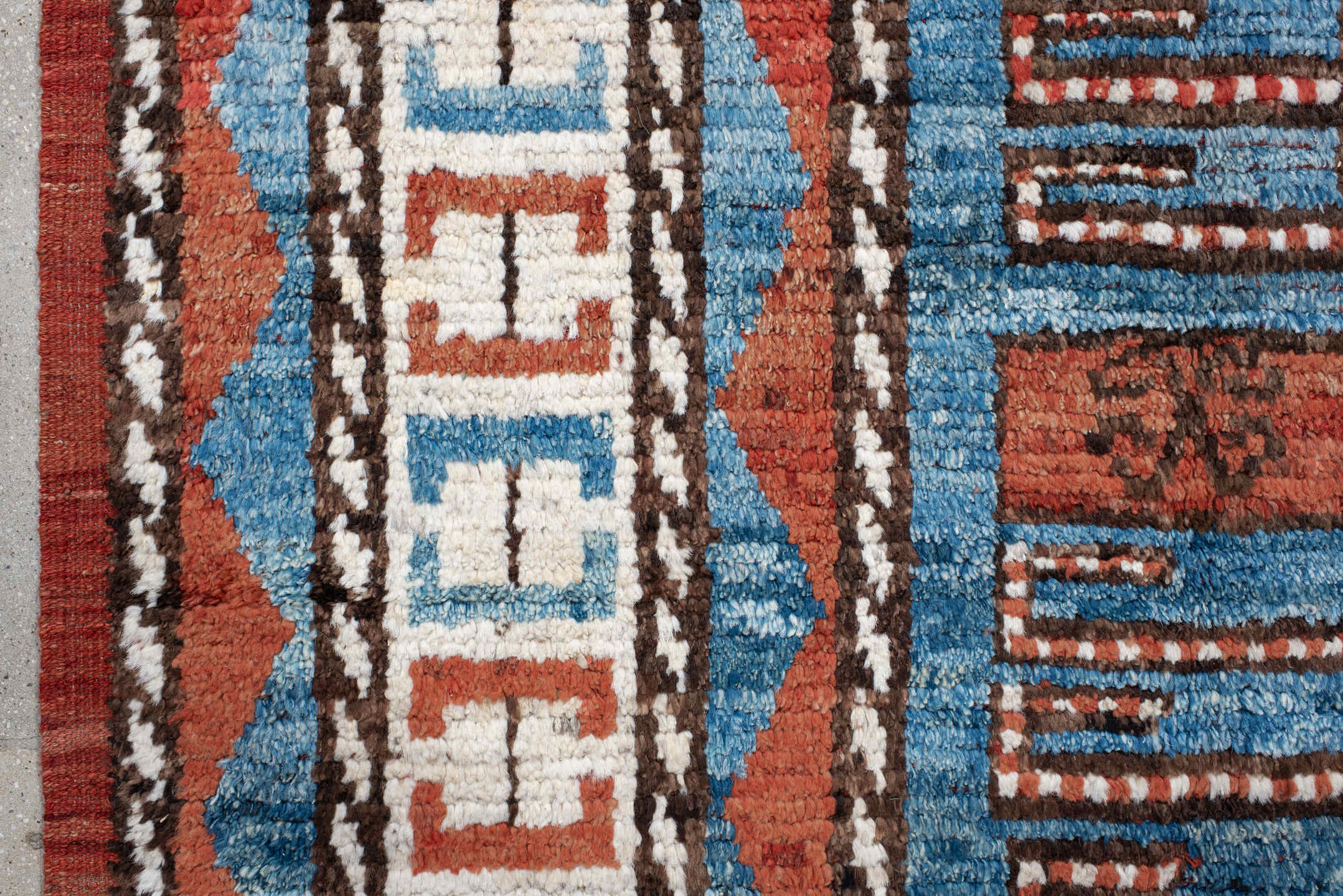 7' x 9' one-of-a-kind handmade vintage Tulu large size rug. Color palette: sky blue, rust, ivory, dark brown, brick, black