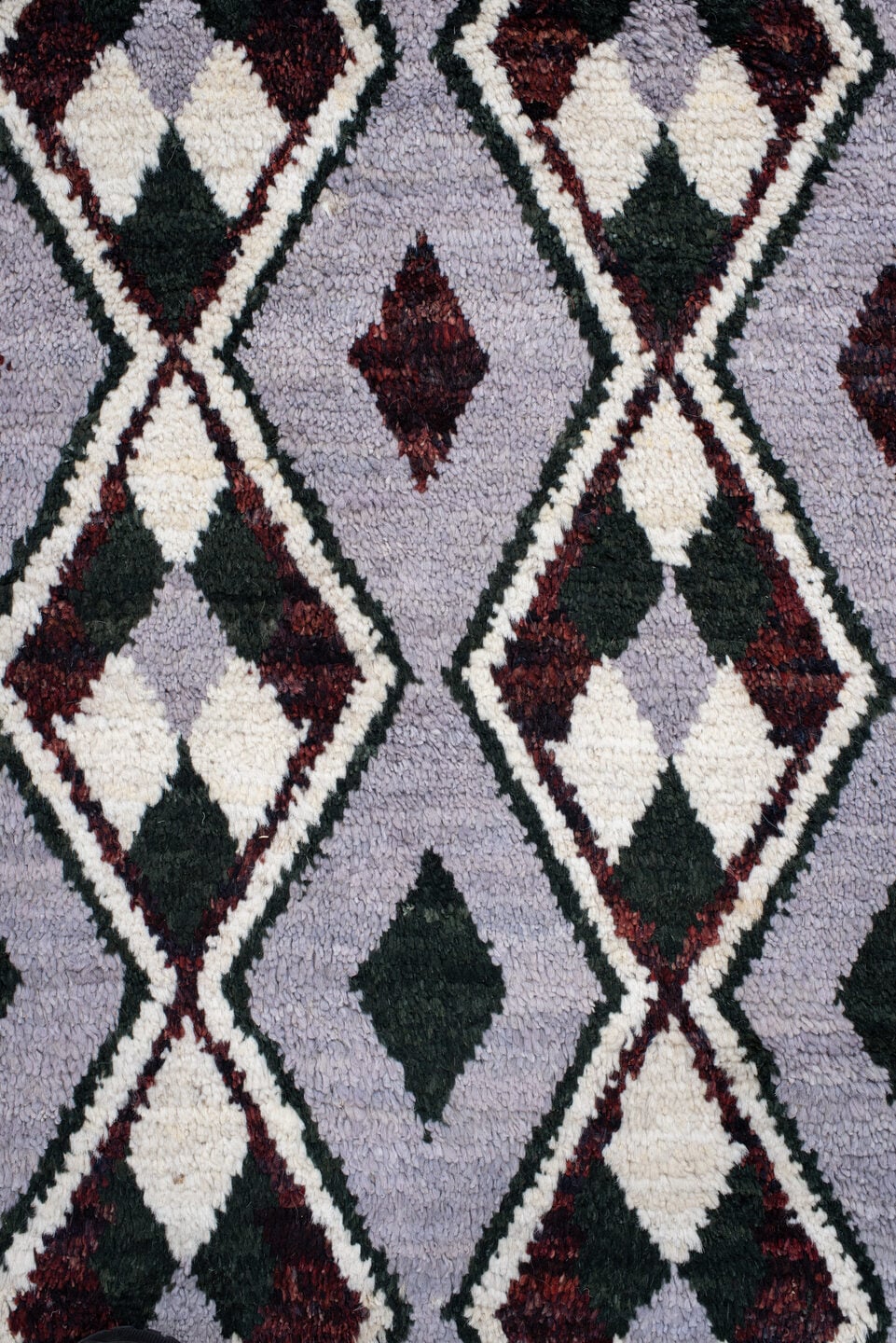 7' x 9' one-of-a-kind handmade vintage Tulu rug. Color palette: lavender, charcoal, ivory, burgundy, light gray, gray, black