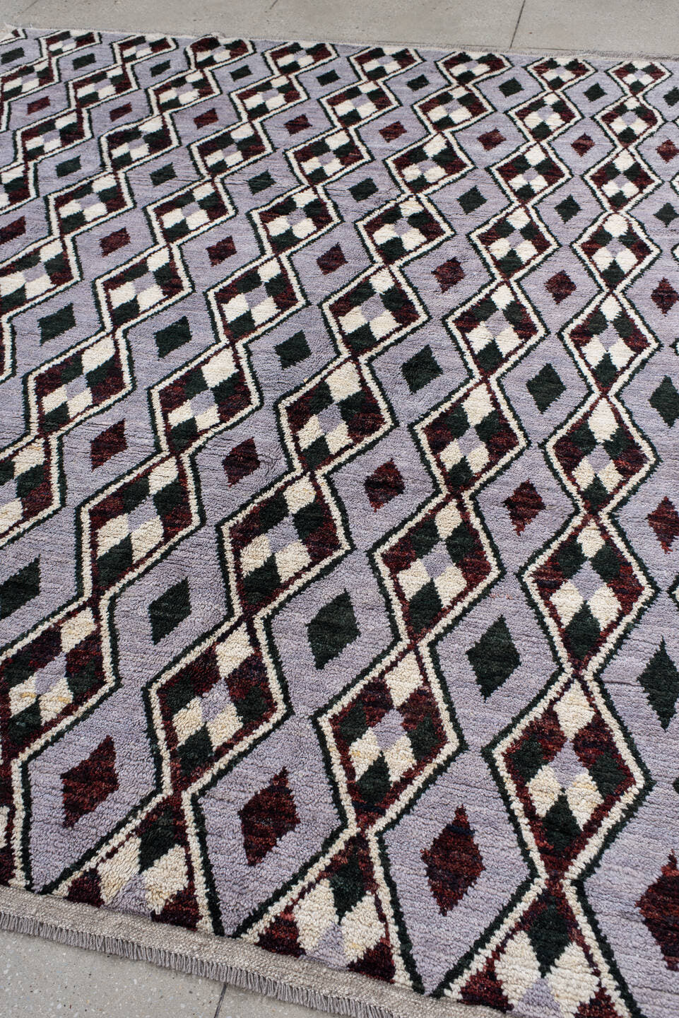 7' x 9' one-of-a-kind handmade vintage Tulu rug. Color palette: lavender, charcoal, ivory, burgundy, light gray, gray, black