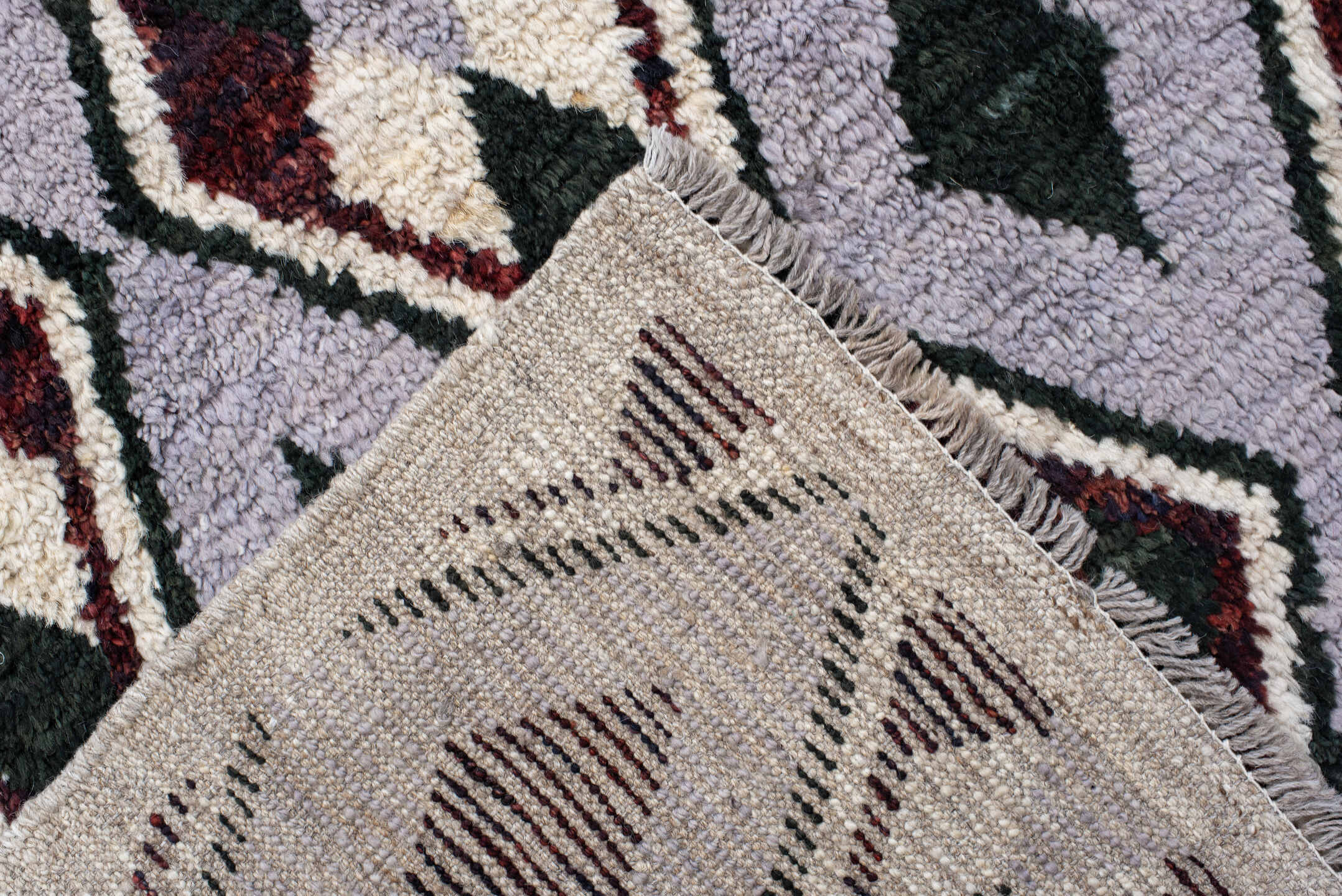 7' x 9' one-of-a-kind handmade vintage Tulu rug. Color palette: lavender, charcoal, ivory, burgundy, light gray, gray, black