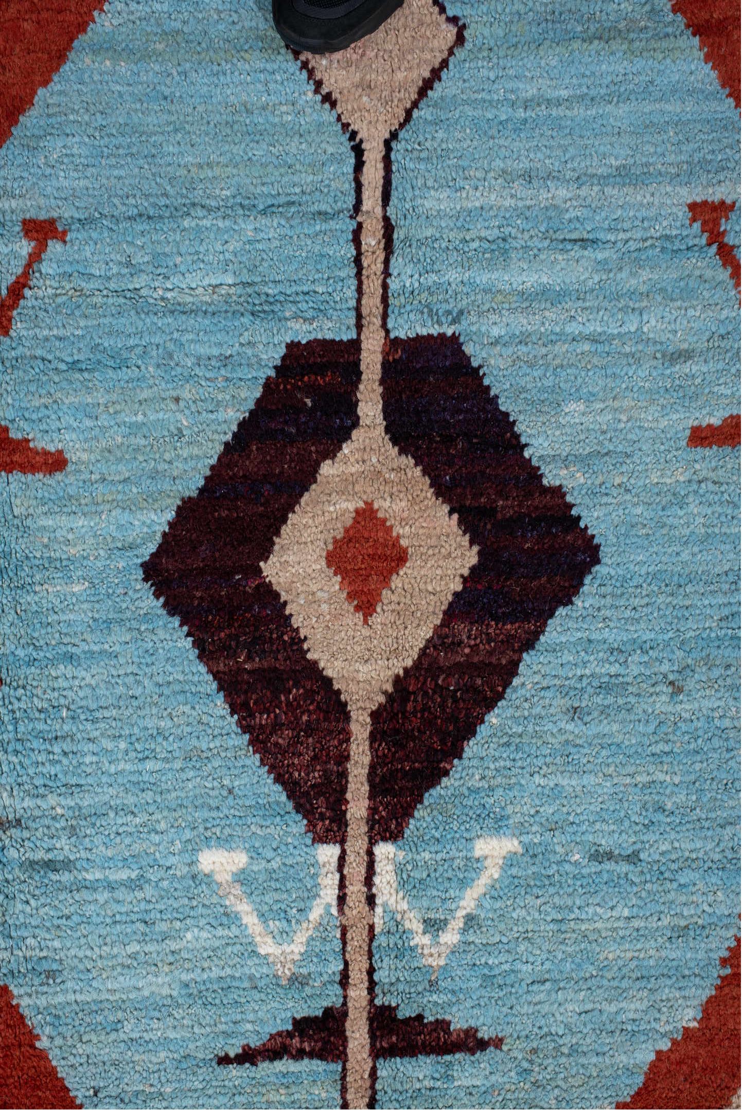 6' x 9' one-of-a-kind handmade vintage Tulu medium size rug. Color palette: sky blue, rust, ivory, plum, cream, terra cotta