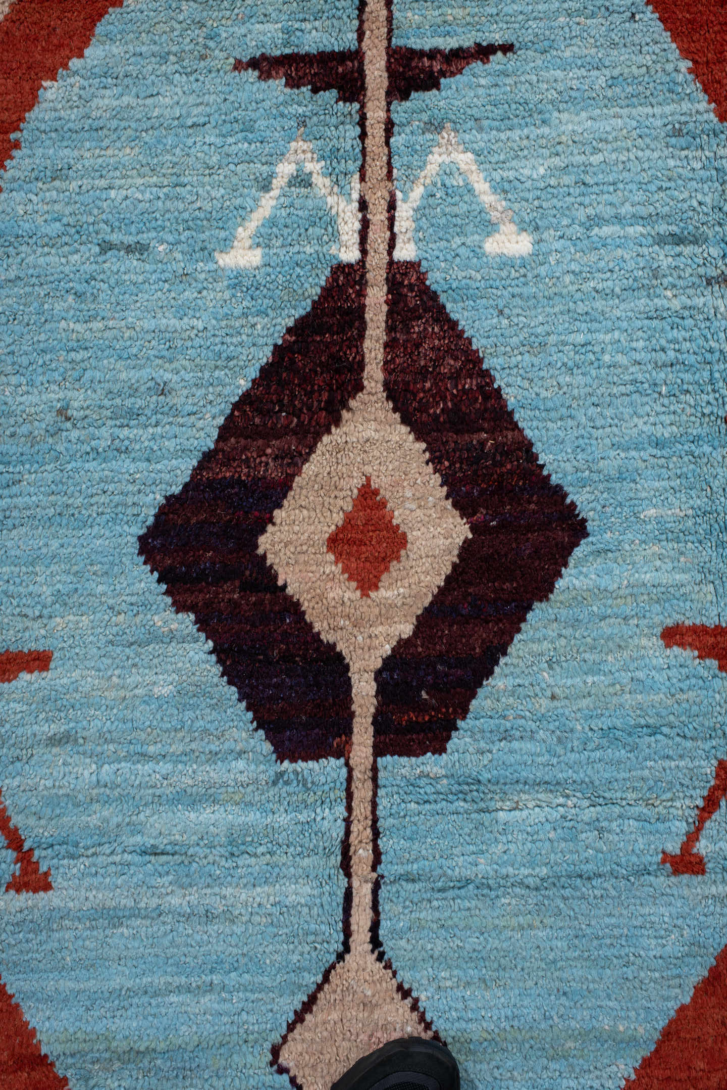 6' x 9' one-of-a-kind handmade vintage Tulu medium size rug. Color palette: sky blue, rust, ivory, plum, cream, terra cotta