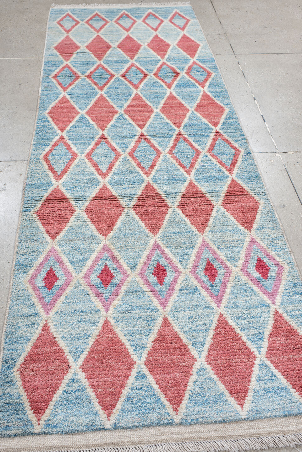 3' x 9' one-of-a-kind handmade vintage Tulu runner rug. Color palette: sky blue, ivory, rose, crimson, lavender, light blue