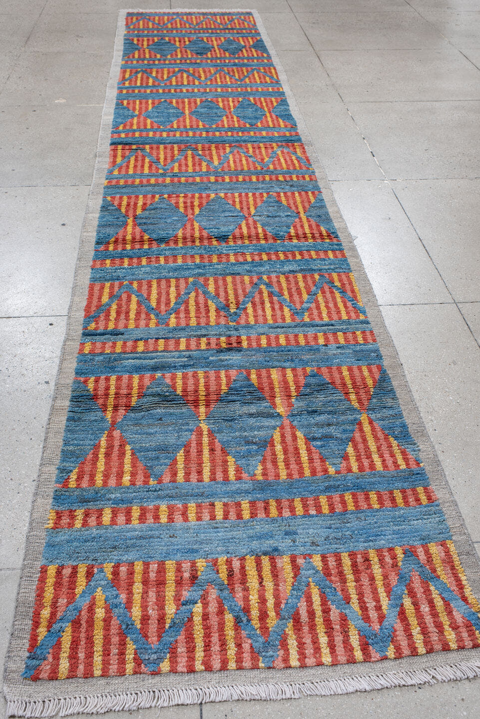 3' x 16' one-of-a-kind handmade vintage Tulu runner rug. Color palette: blue, rust, gold, ivory, orange, terracotta, brown