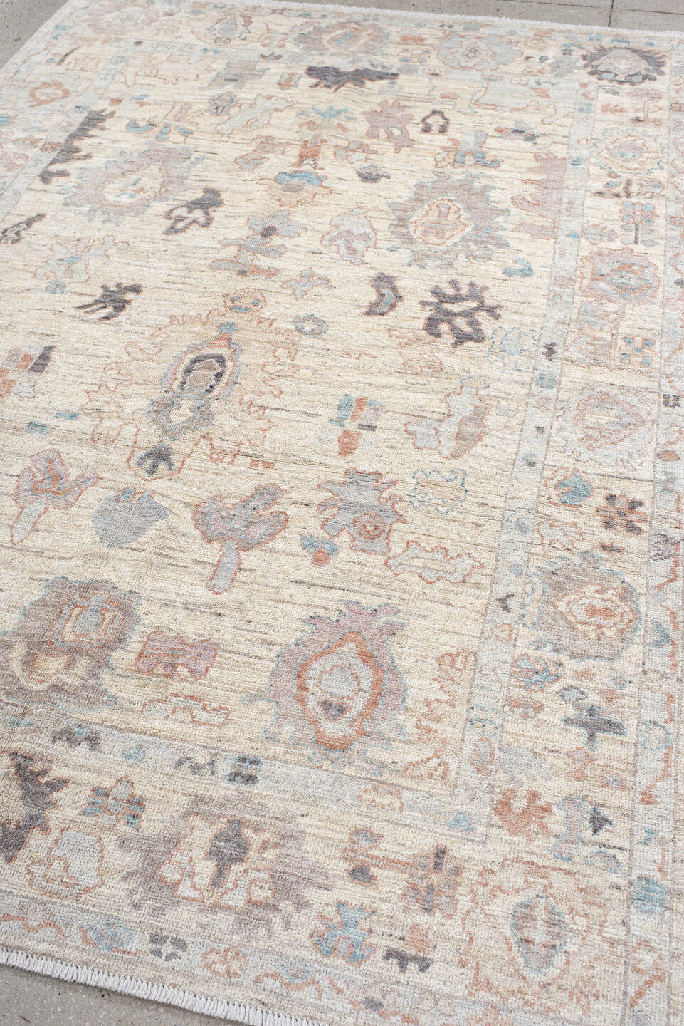 6' x 8' one-of-a-kind handmade vintage Oushak medium size rug. Color palette: ivory, cream, taupe, pale blue, blush