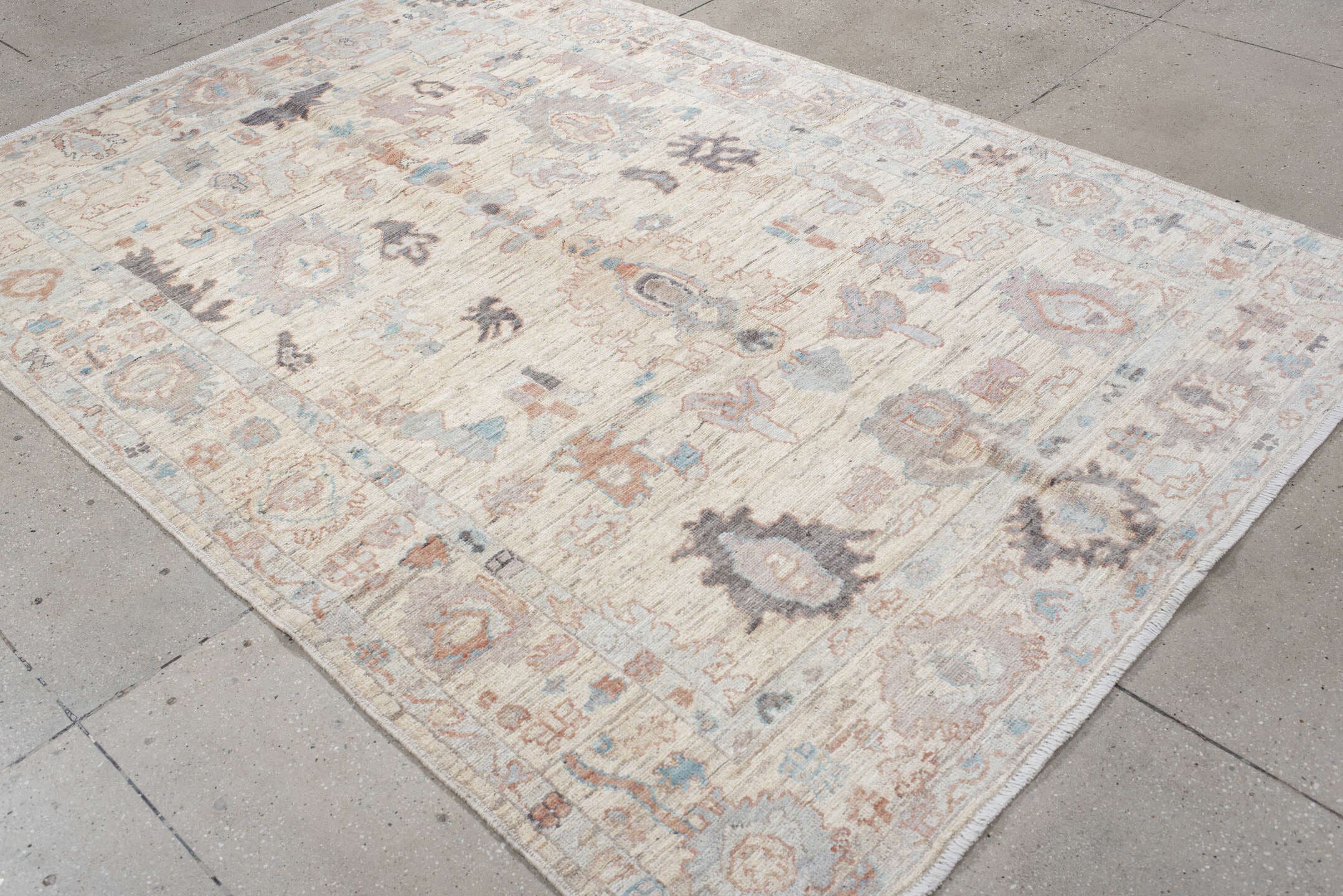 6' x 8' one-of-a-kind handmade vintage Oushak medium size rug. Color palette: ivory, cream, taupe, pale blue, blush