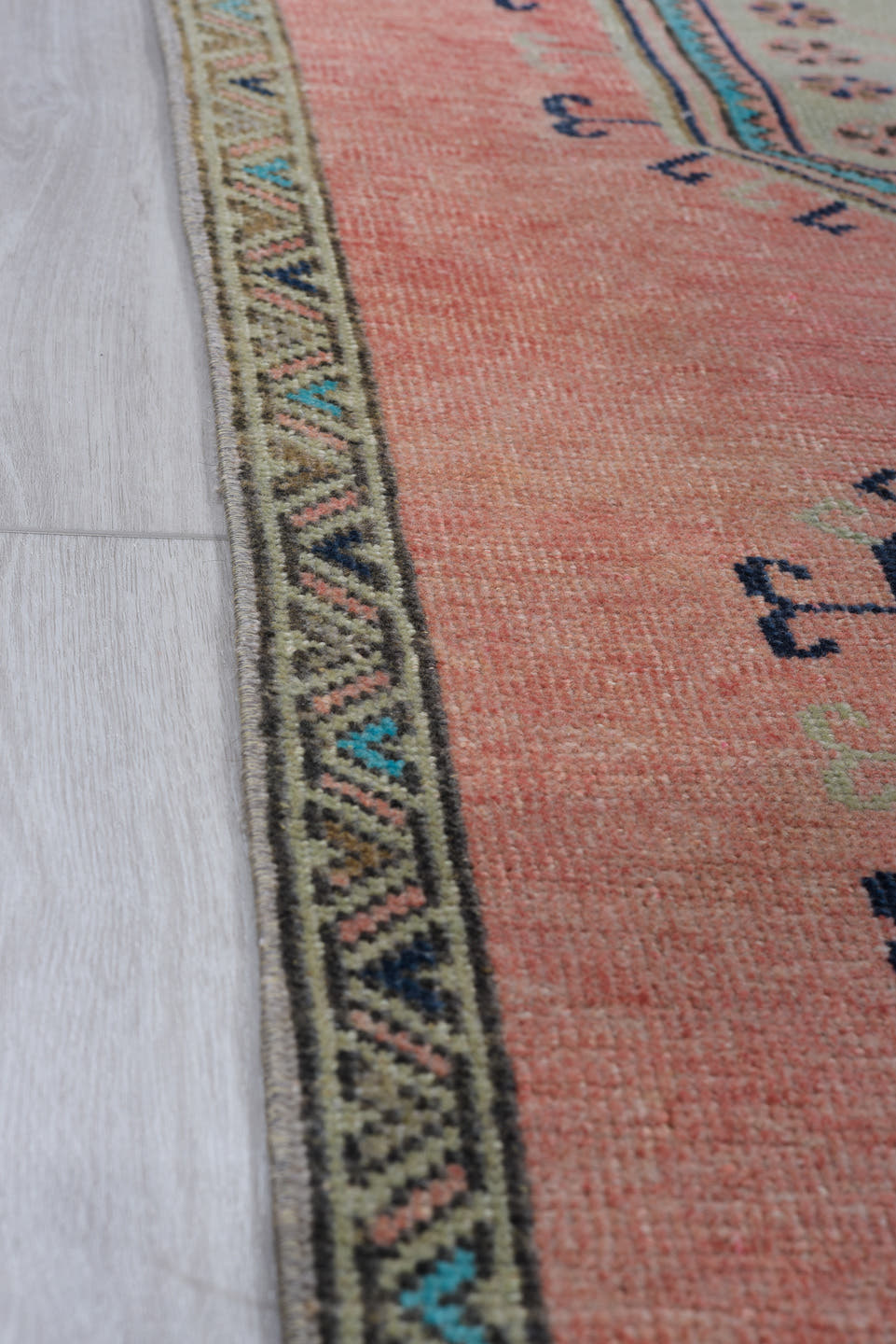 3' x 9' one-of-a-kind handmade antique Oushak runner rug. Color palette: rose, navy, ivory, aqua, taupe, charcoal, pink, red