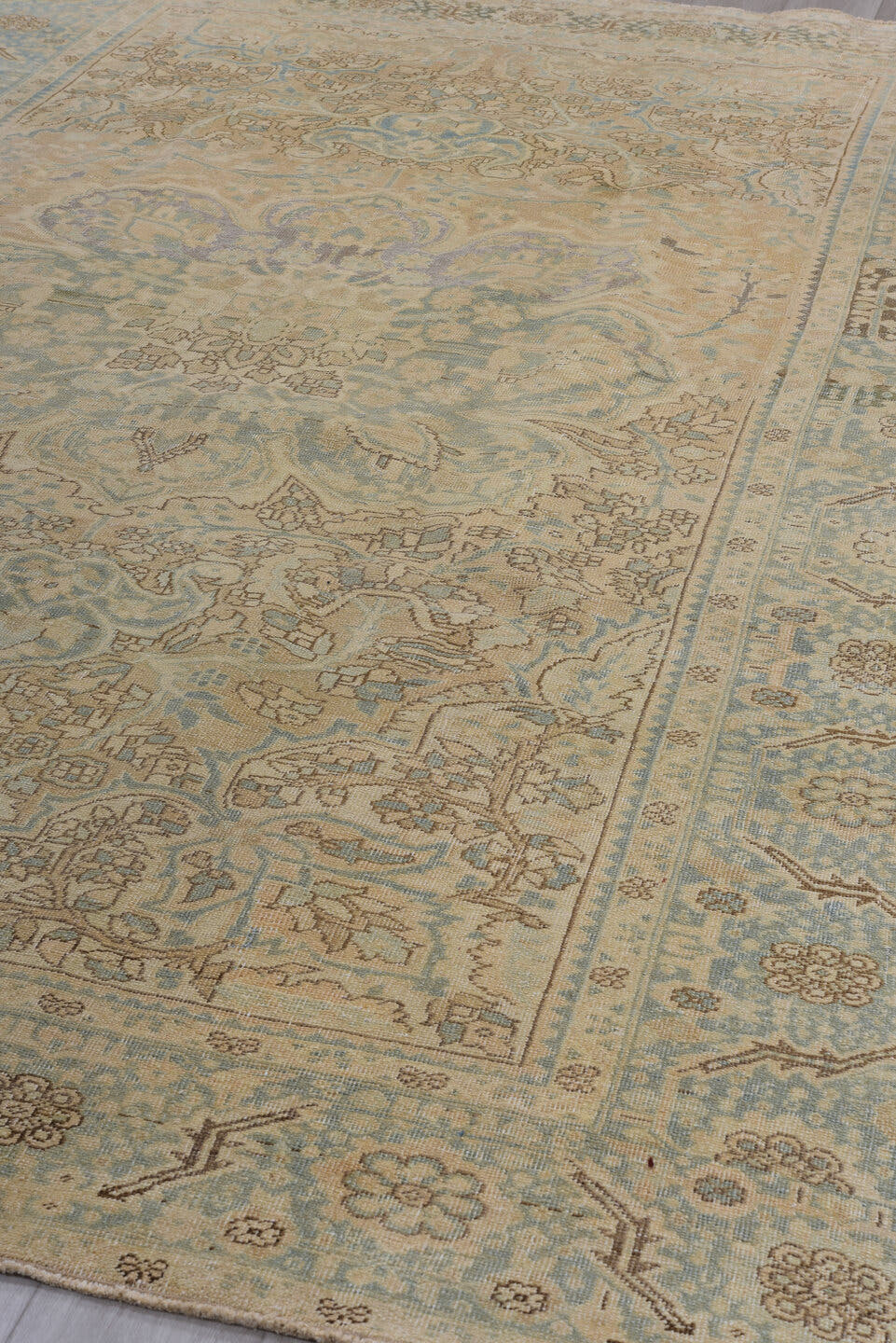 7' x 11' one-of-a-kind handmade antique Heriz large size rug. Color palette: ivory, pale blue, beige, taupe, slate, camel