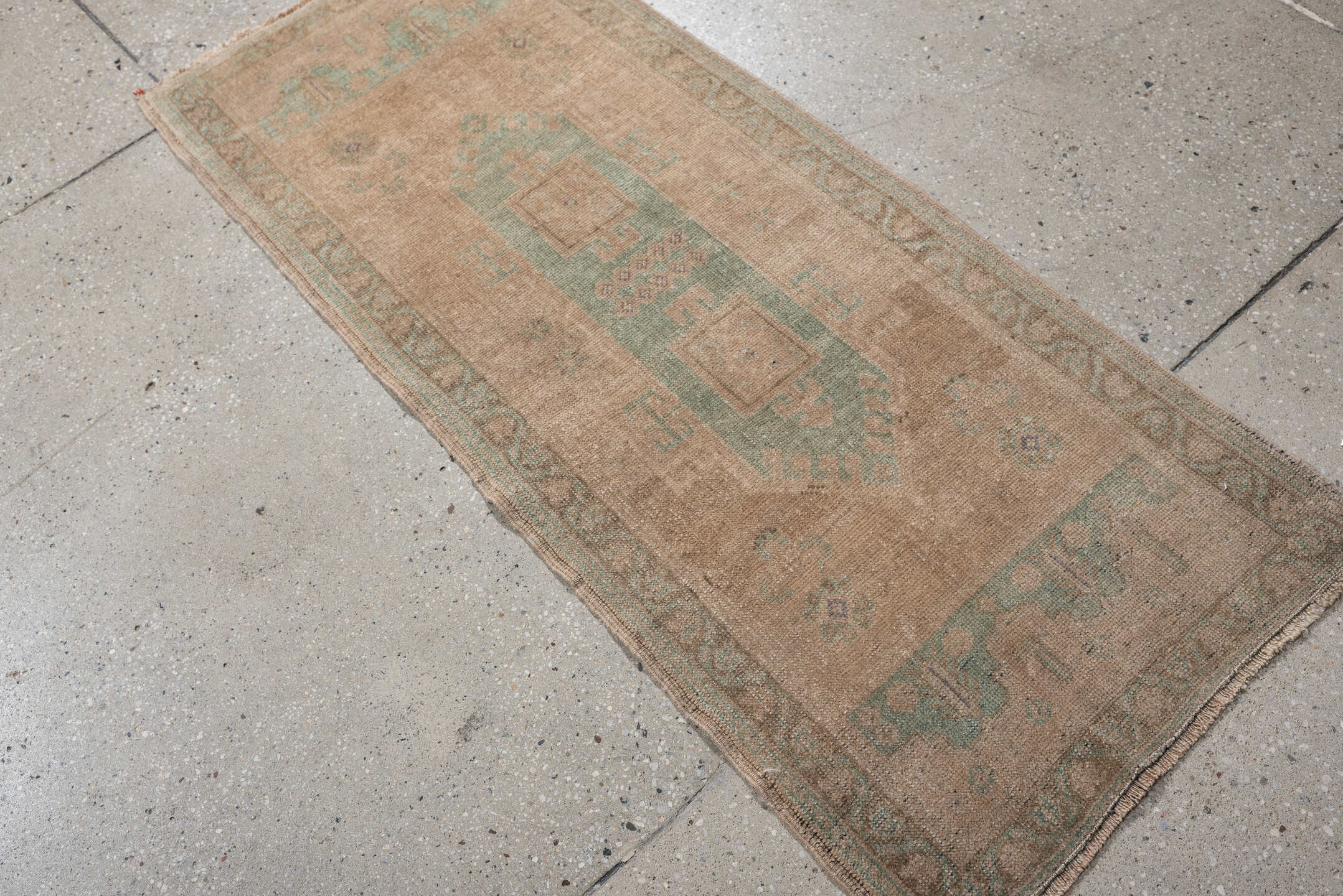 1' x 4' one-of-a-kind handmade vintage Oushak small size rug. Color palette: tan, sage, taupe, ivory, camel, beige, green