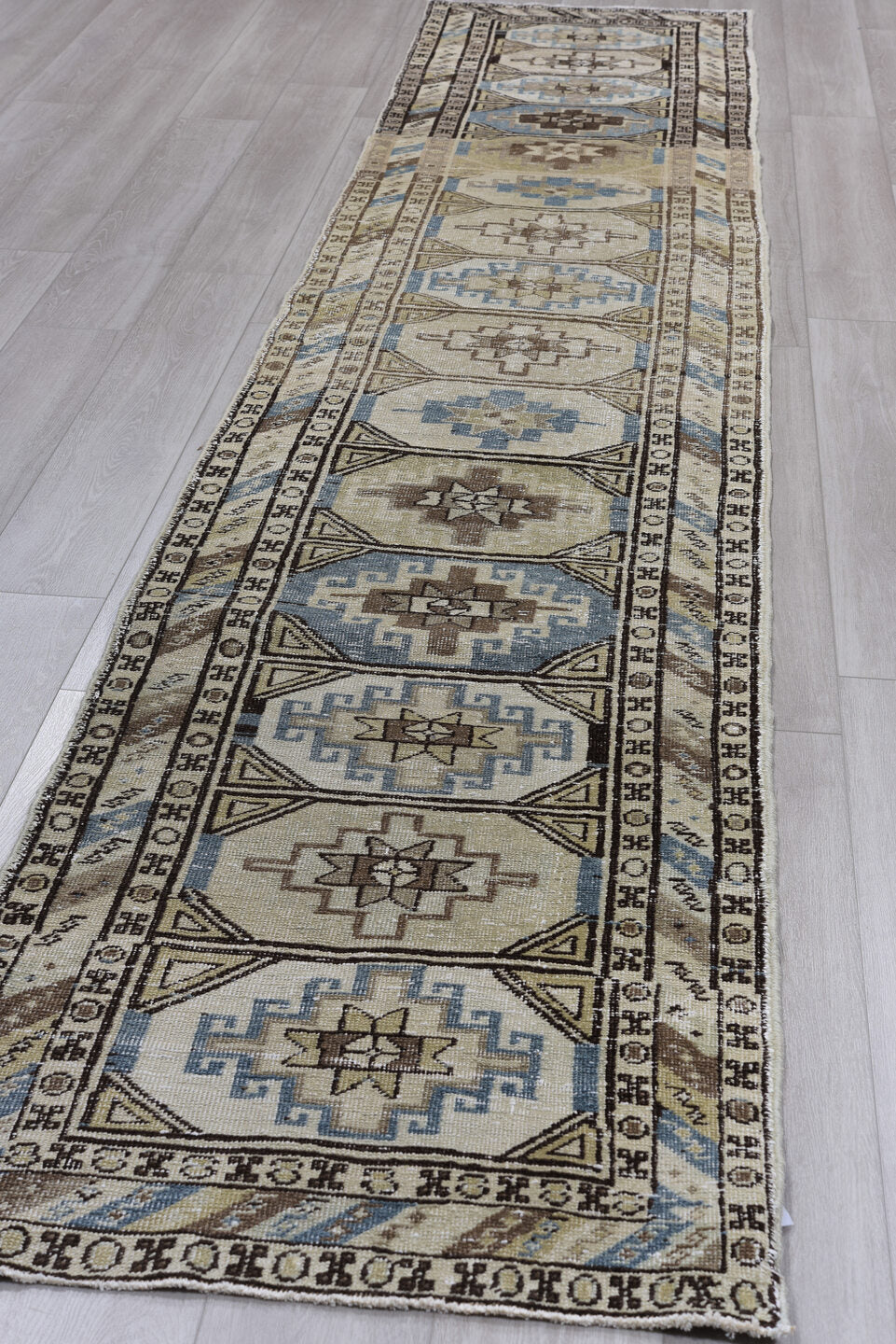 2' x 14' one-of-a-kind handmade antique Meshkin runner rug. Color palette: ivory, sky blue, taupe, brown, charcoal, beige