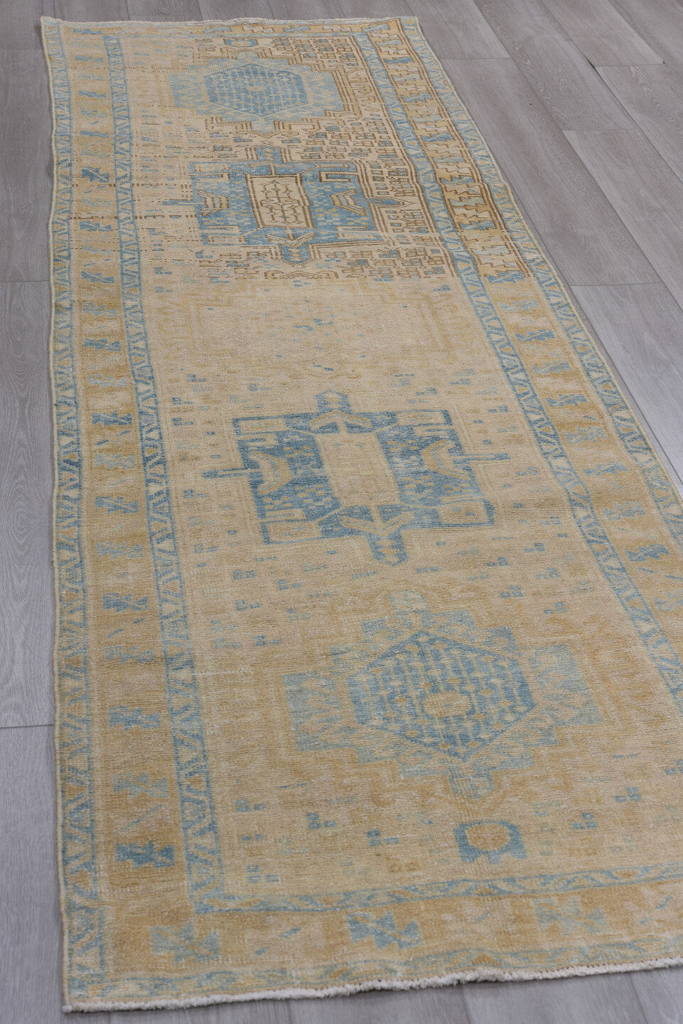 3' x 10' one-of-a-kind handmade vintage Heriz runner rug. Color palette: brown, gray, light blue, light gray, off-white