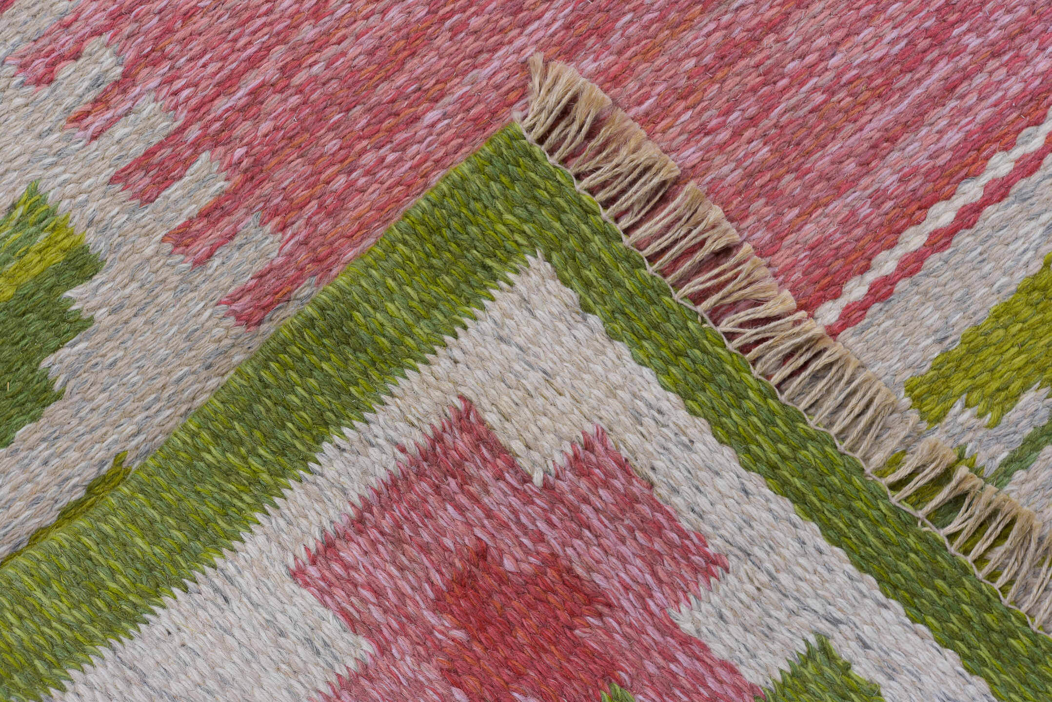 6' x 9' one-of-a-kind handmade vintage Rollaken medium size rug. Color palette: rose, ivory, olive, sage, pink, red, green