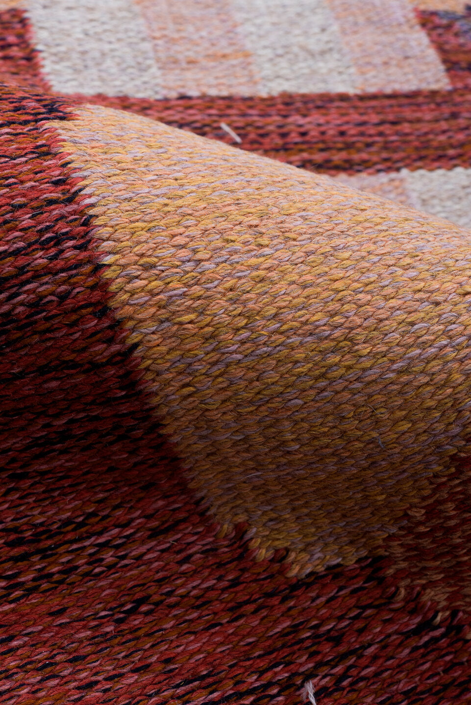 5' x 8' one-of-a-kind handmade vintage Rollaken medium size rug. Color palette: black, blue, brown, gray, indian red