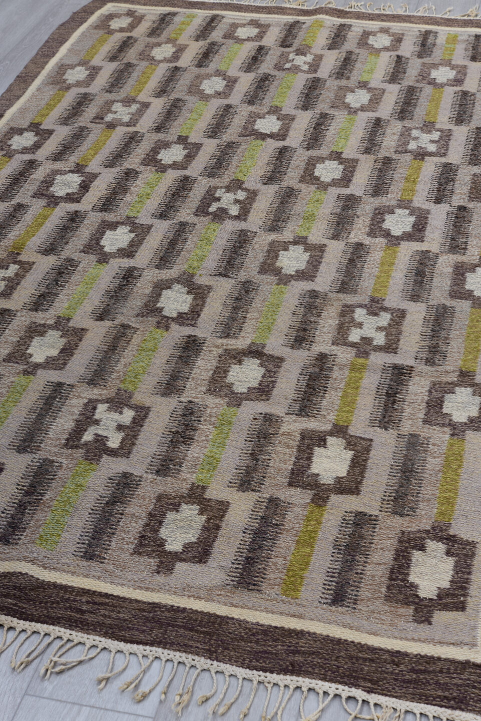 4' x 8' one-of-a-kind handmade vintage Rollaken rug. Color palette: brown, dark gray, dark khaki, gray, light gray
