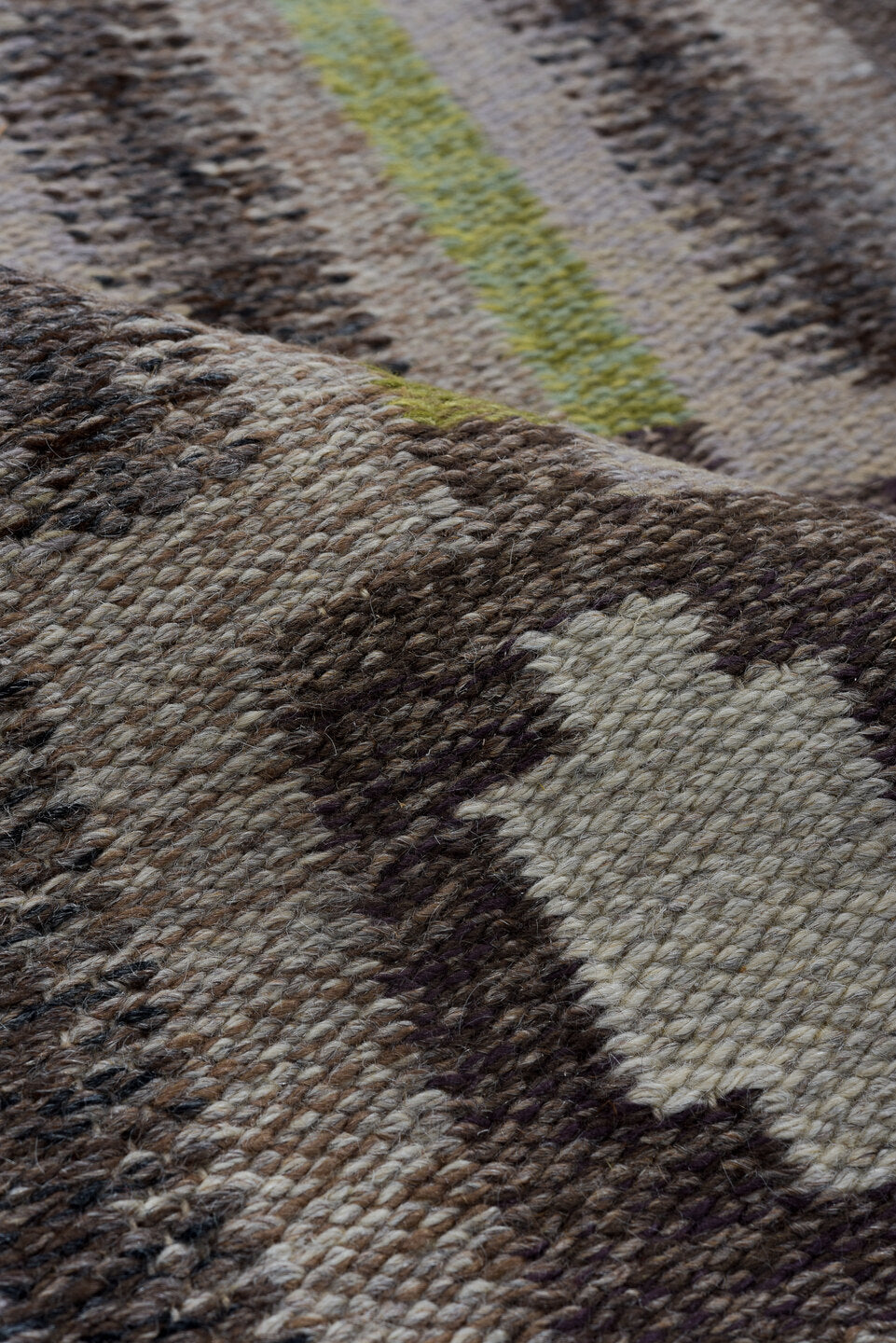 4' x 8' one-of-a-kind handmade vintage Rollaken rug. Color palette: brown, dark gray, dark khaki, gray, light gray