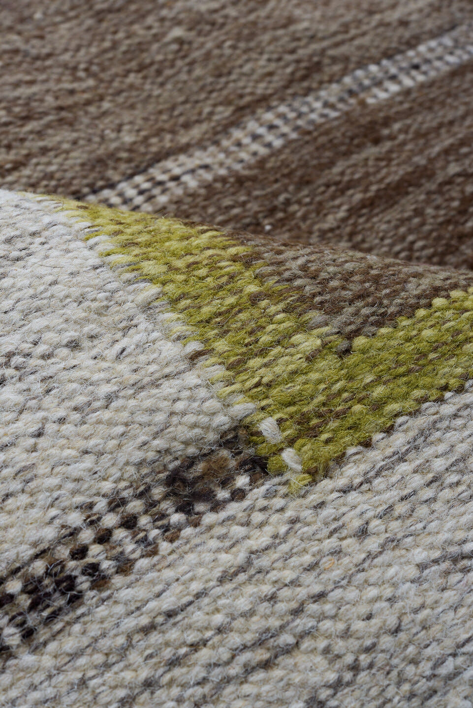 5' x 7' one-of-a-kind handmade antique Rollaken rug. Color palette: brown, ivory, taupe, olive, camel, beige, gray, green
