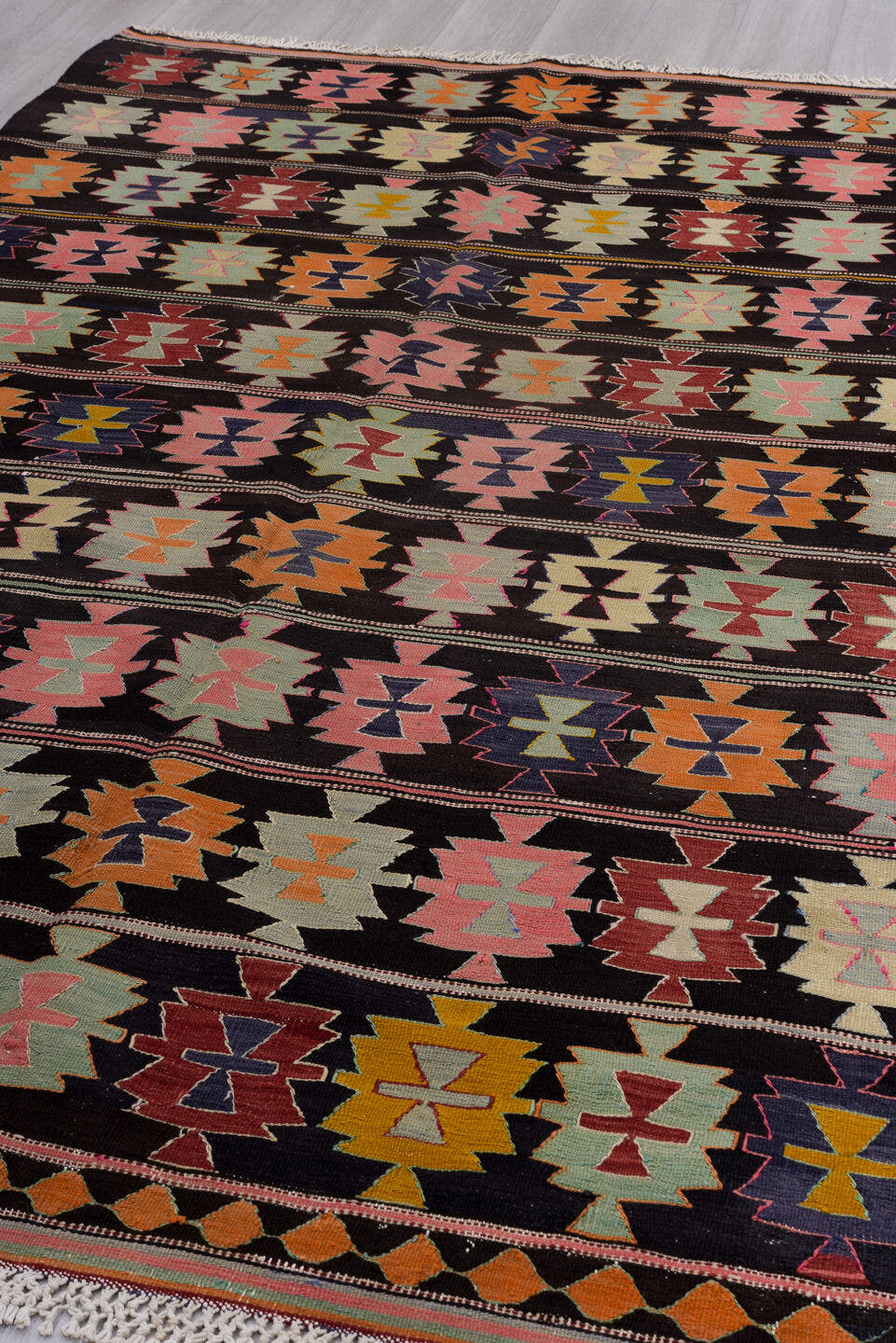 5' x 9' one-of-a-kind handmade antique Kilim medium size rug. Color palette: charcoal, rose, ivory, rust, sage, indigo