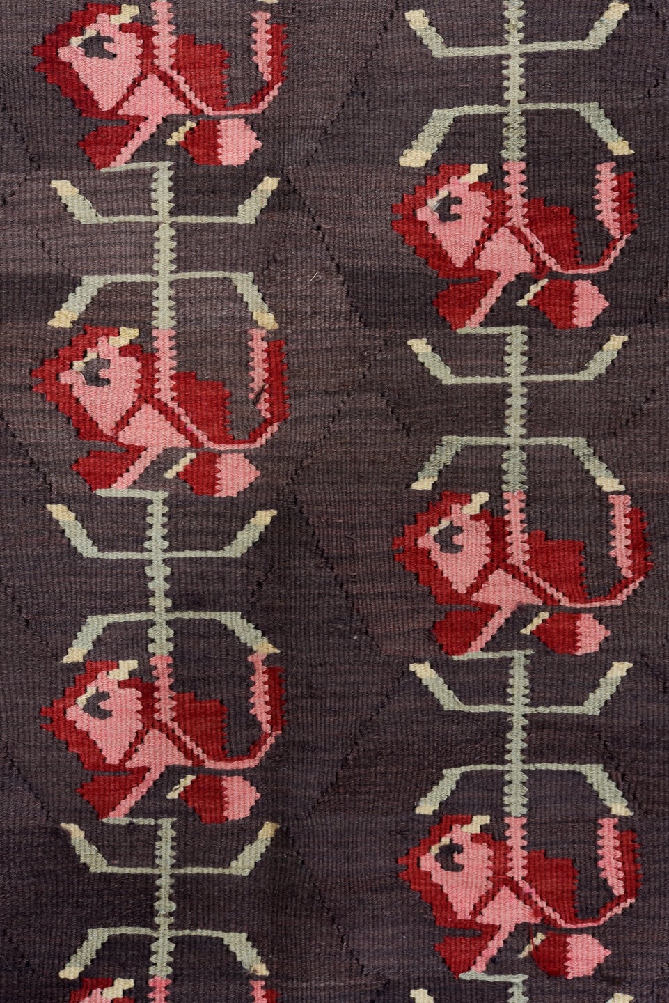 5' x 11' one-of-a-kind handmade antique Besserabian rug. Color palette: charcoal, taupe, crimson, rose, ivory, black, gray