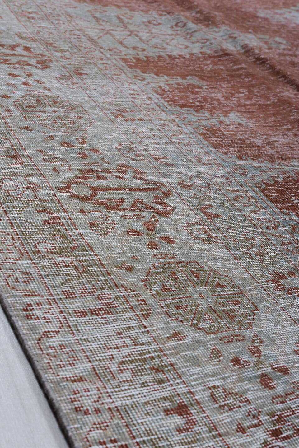 10' x 12' one-of-a-kind handmade antique Veece large size rug. Color palette: terra cotta, ivory, pale blue, taupe, rust