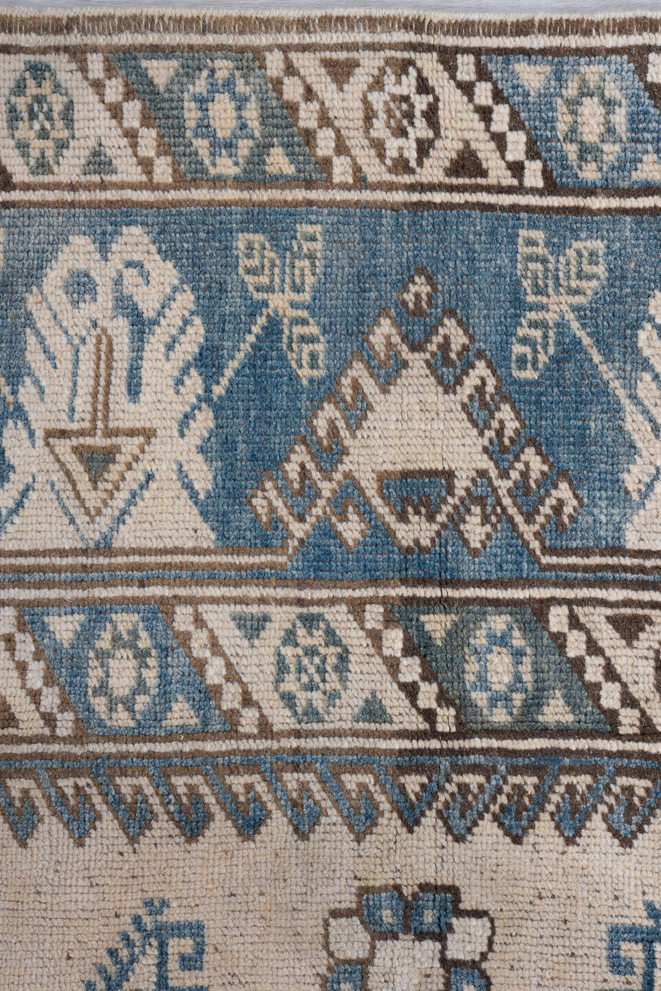 4' x 5' one-of-a-kind handmade vintage Oushak small size rug. Color palette: ivory, sky blue, taupe, brown, pale blue