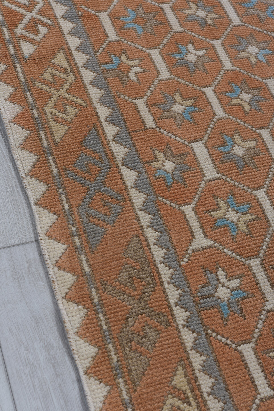 3' x 11' one-of-a-kind handmade antique Oushak runner rug. Color palette: terra cotta, ivory, sky blue, taupe, camel, brown