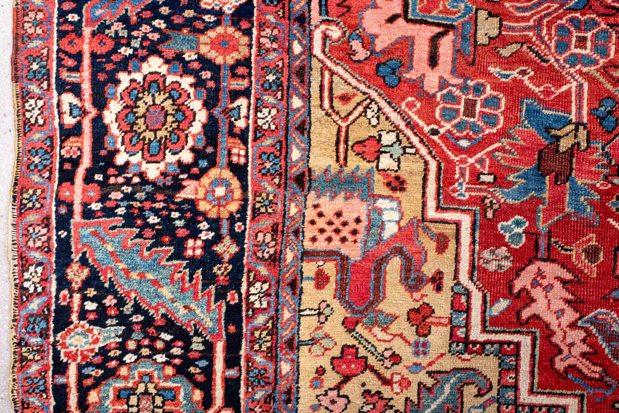 11' x 14' one-of-a-kind handmade vintage Heriz oversize rug. Color palette: red, navy, ivory, sky blue, coral, camel, pink