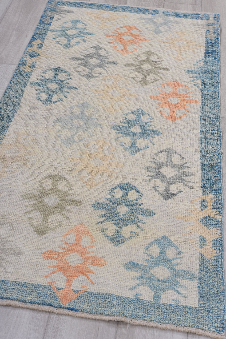 2' x 5' one-of-a-kind handmade vintage Oushak small size rug. Color palette: ivory, sky blue, slate blue, apricot