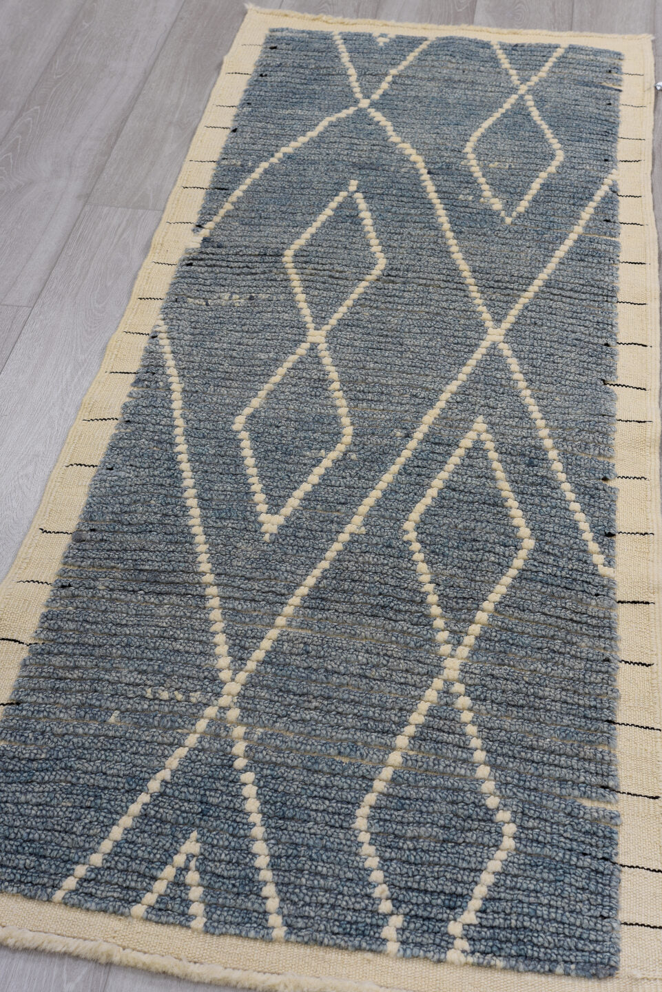 2' x 6' one-of-a-kind handmade vintage Tulu runner rug. Color palette: blue, gray, light gray, off-white