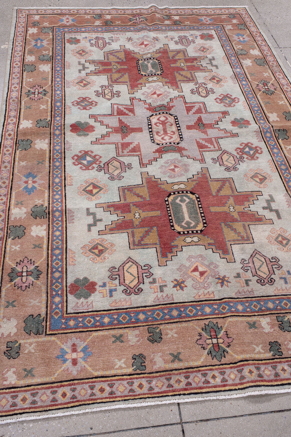 4' x 7' one-of-a-kind handmade antique Khotan rug. Color palette: ivory, camel, rose, dusty blue, sage, rust, taupe, beige