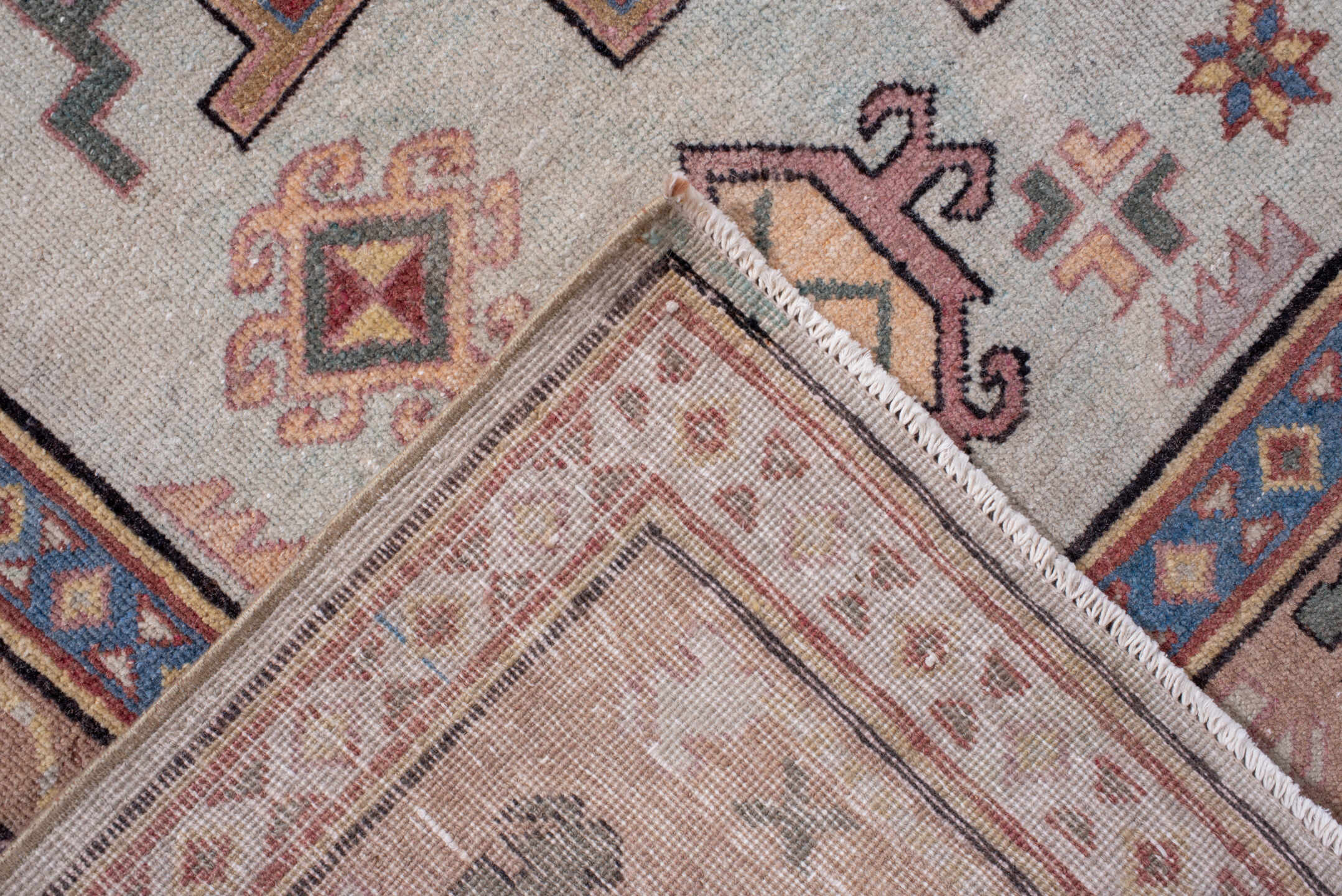 4' x 7' one-of-a-kind handmade antique Khotan rug. Color palette: ivory, camel, rose, dusty blue, sage, rust, taupe, beige