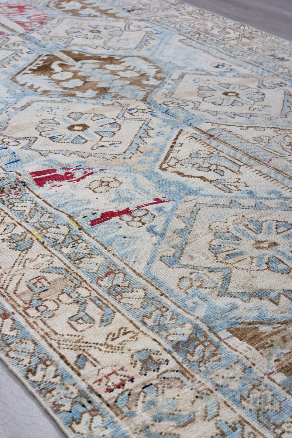5' x 9' one-of-a-kind handmade antique Baktiary medium size rug. Color palette: ivory, sky blue, camel, brown, rose, crimson